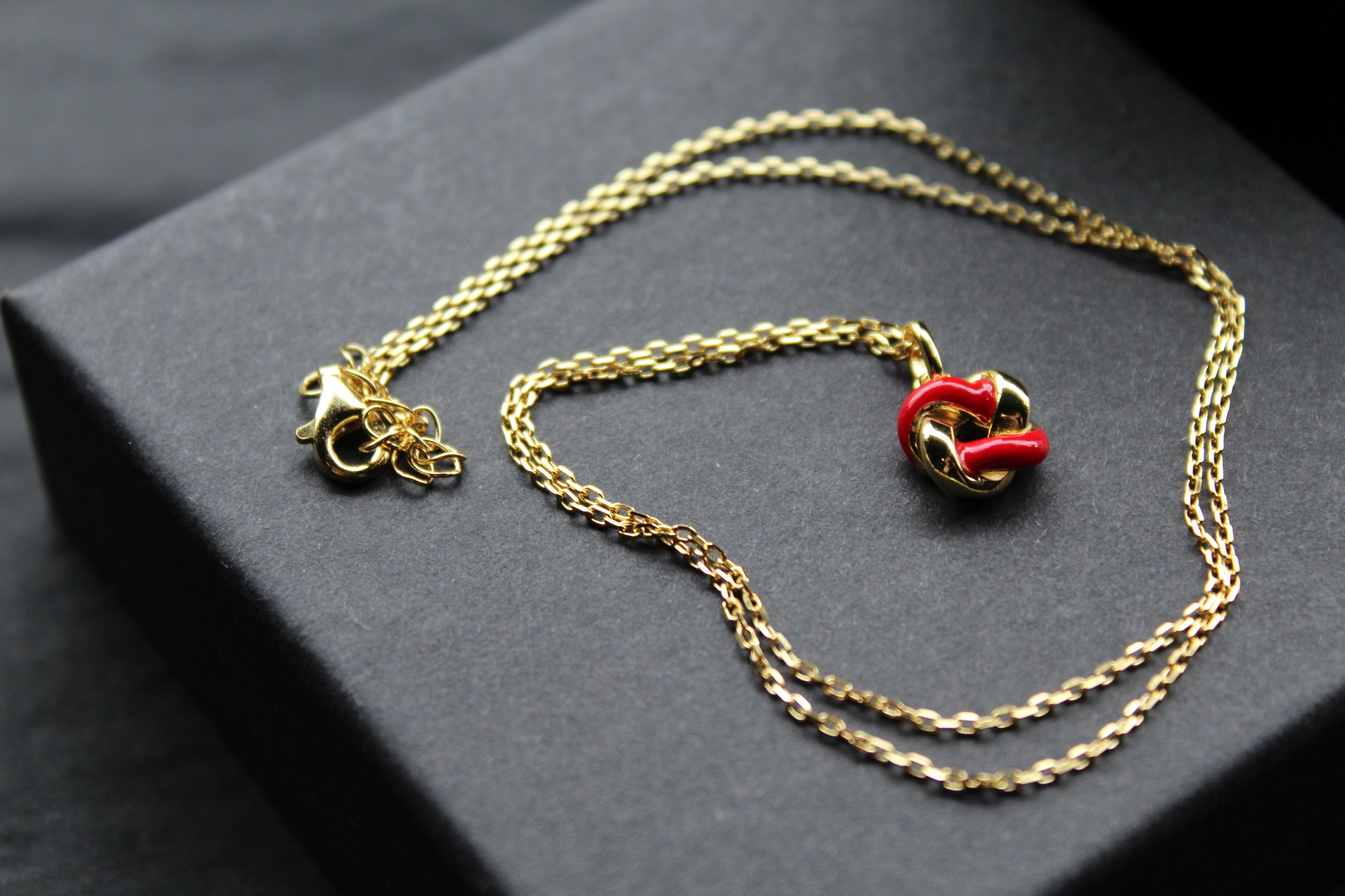 Gold Plated Ruby Red Enamel Knot Necklace
