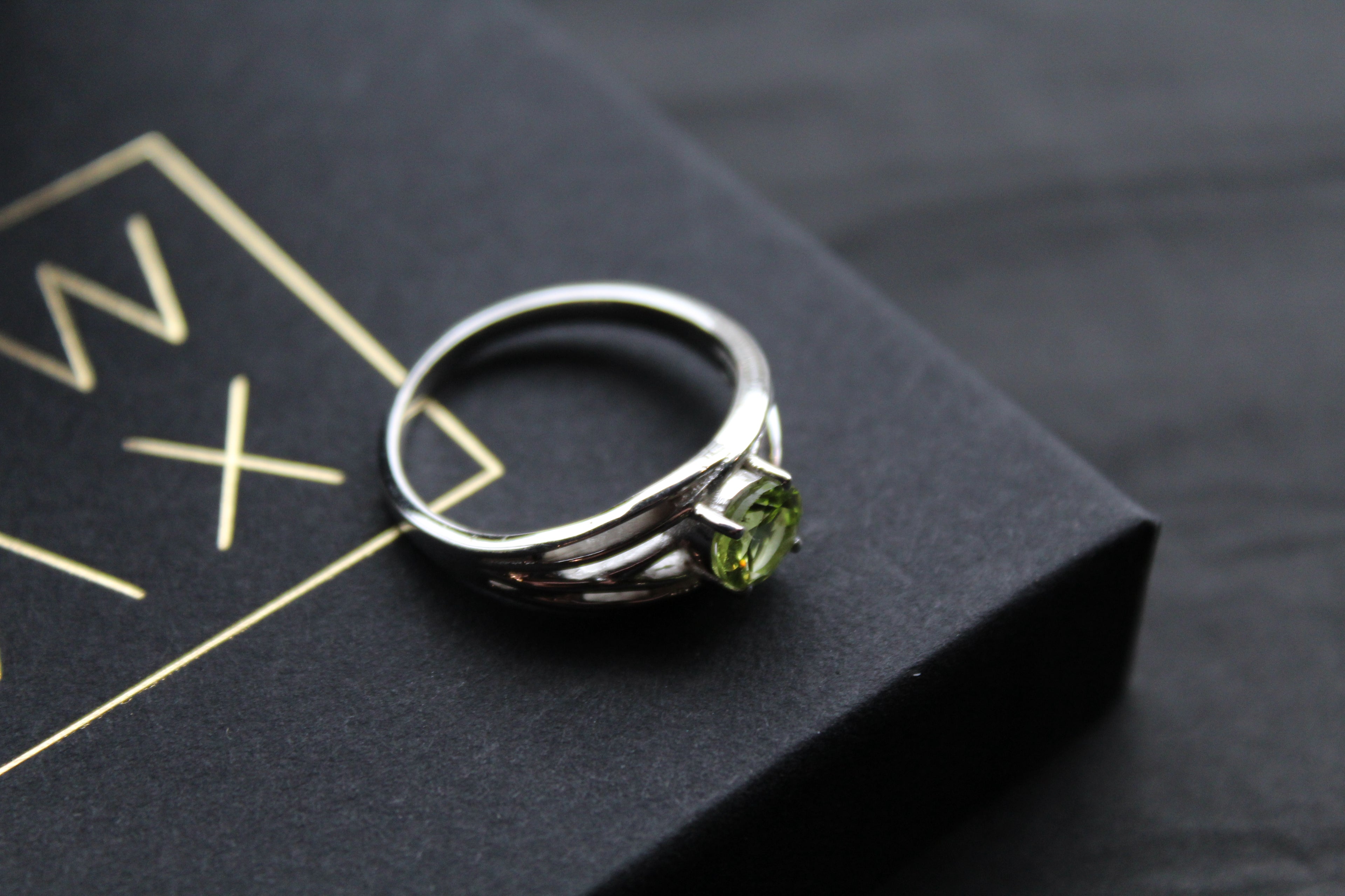 Multi Strand Ring with Faceted Peridot