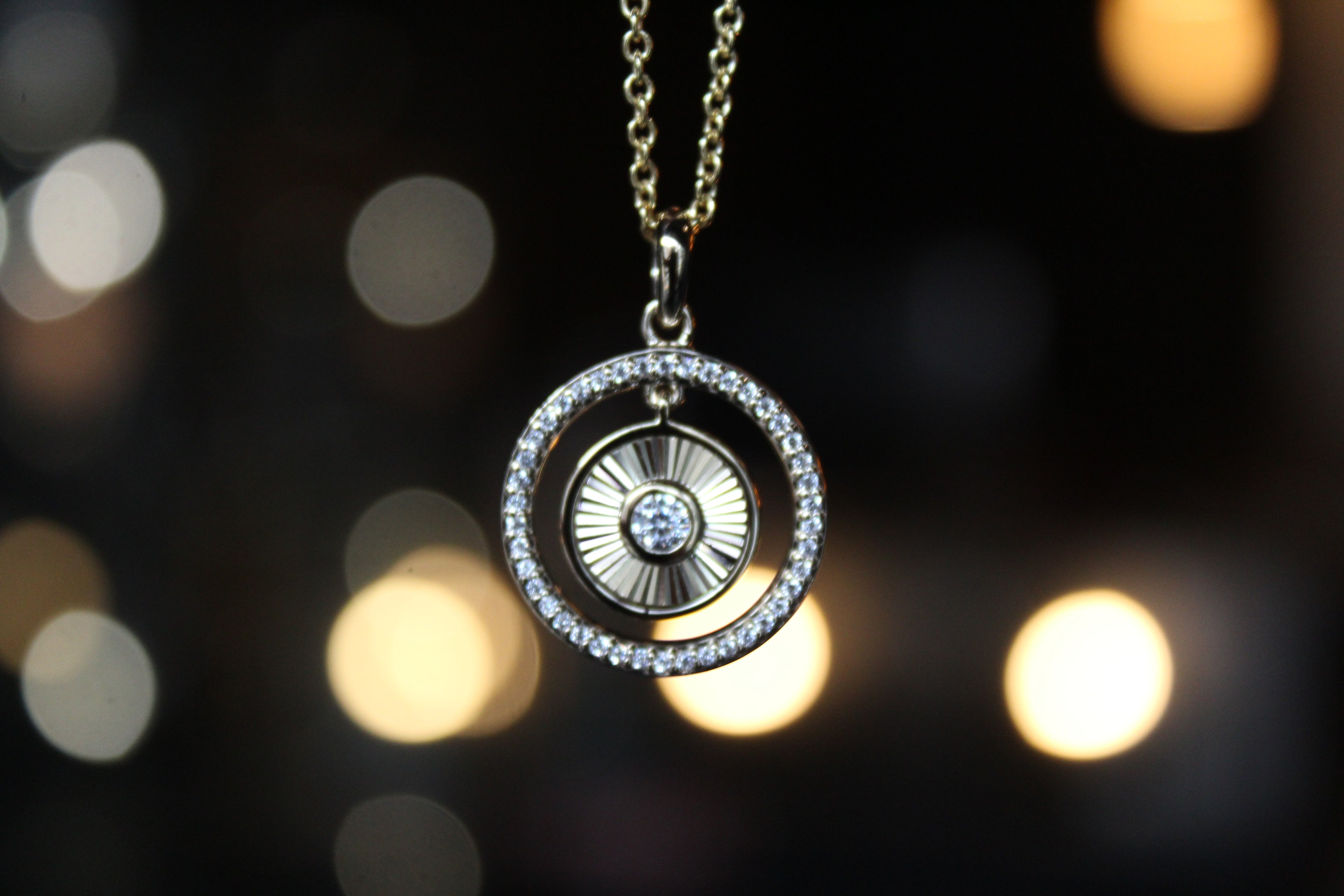 Small Sunburst Circle with Cubic Zirconia Halo Surround