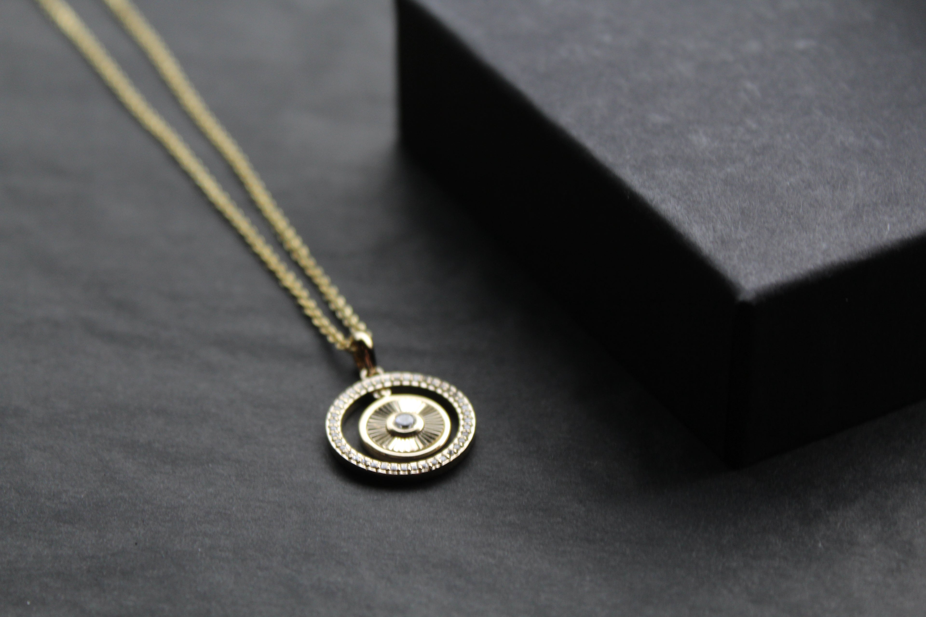 Small Sunburst Circle with Cubic Zirconia Halo Surround
