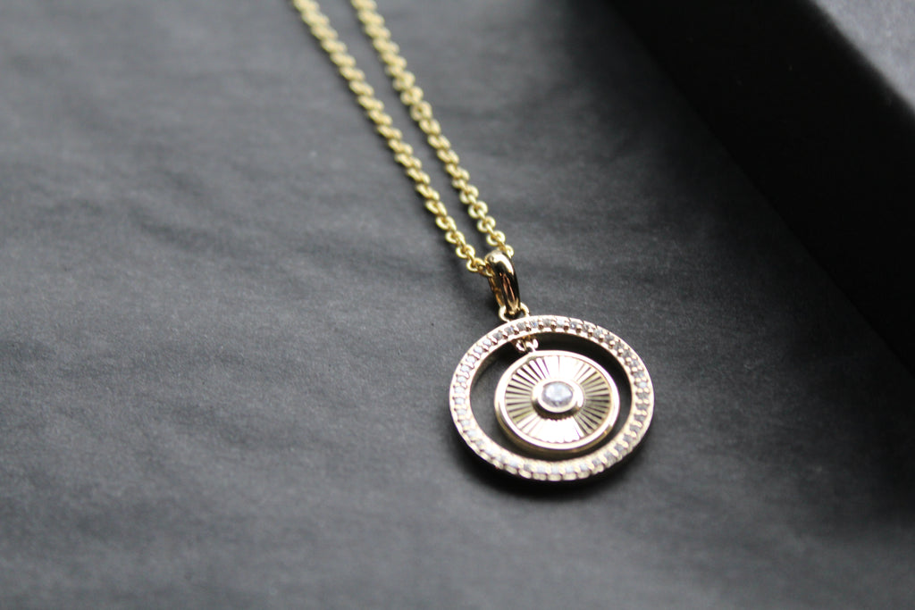 Small Sunburst Circle with Cubic Zirconia Halo Surround