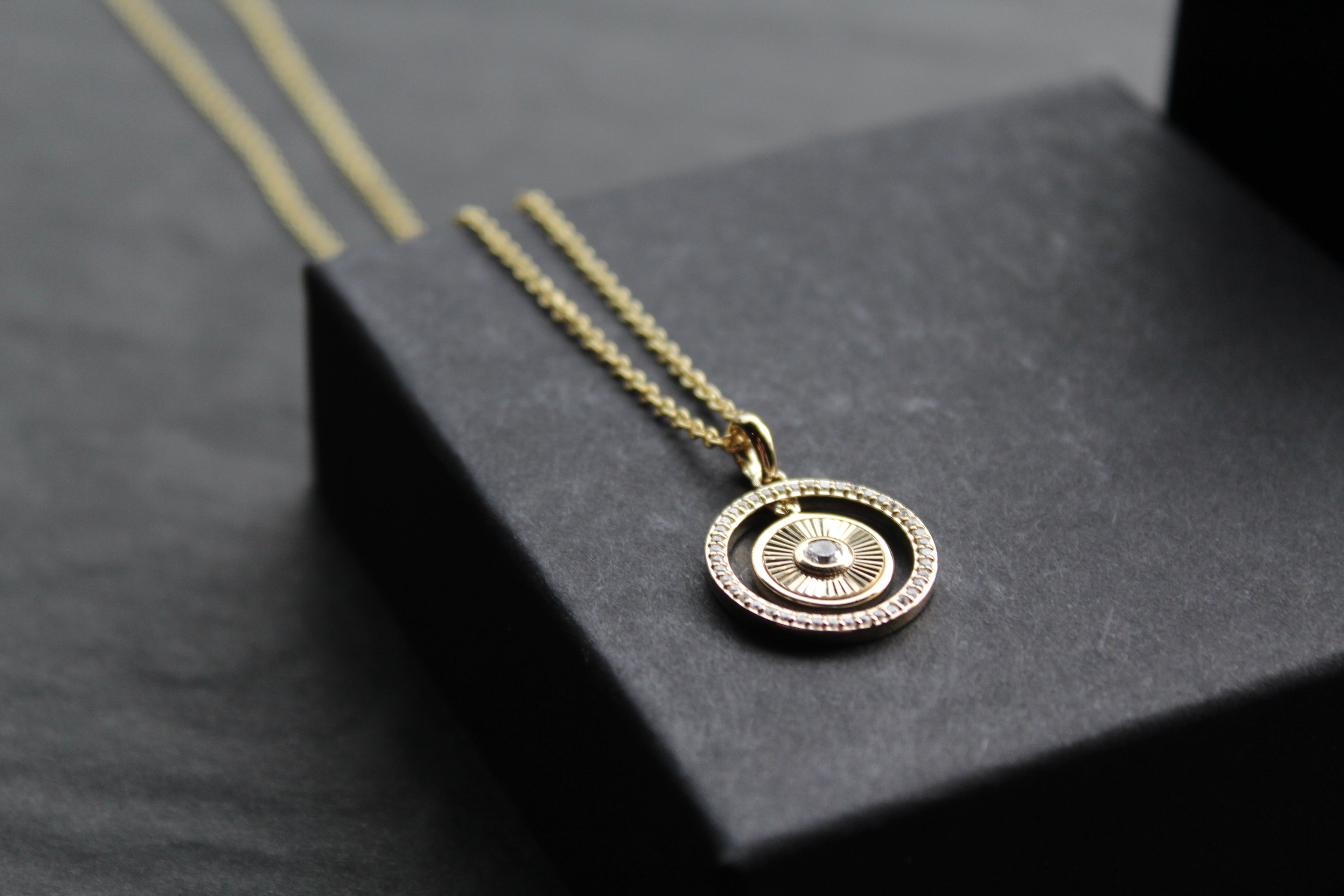 Small Sunburst Circle with Cubic Zirconia Halo Surround