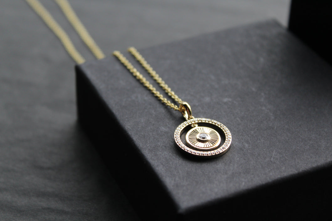 Small Sunburst Circle with Cubic Zirconia Halo Surround