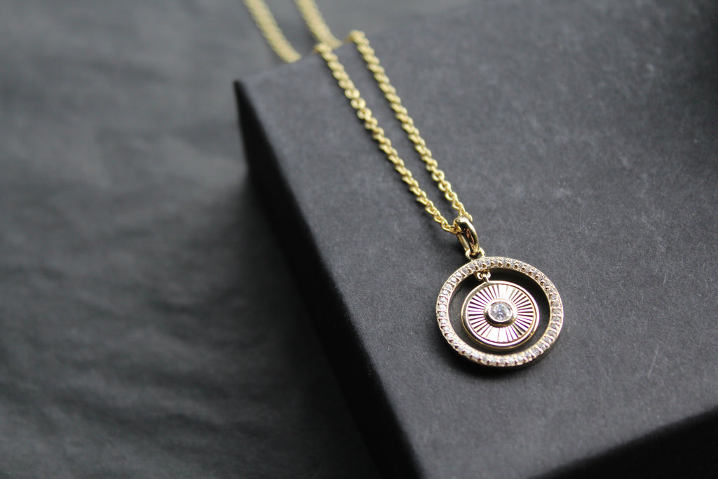 Small Sunburst Circle with Cubic Zirconia Halo Surround