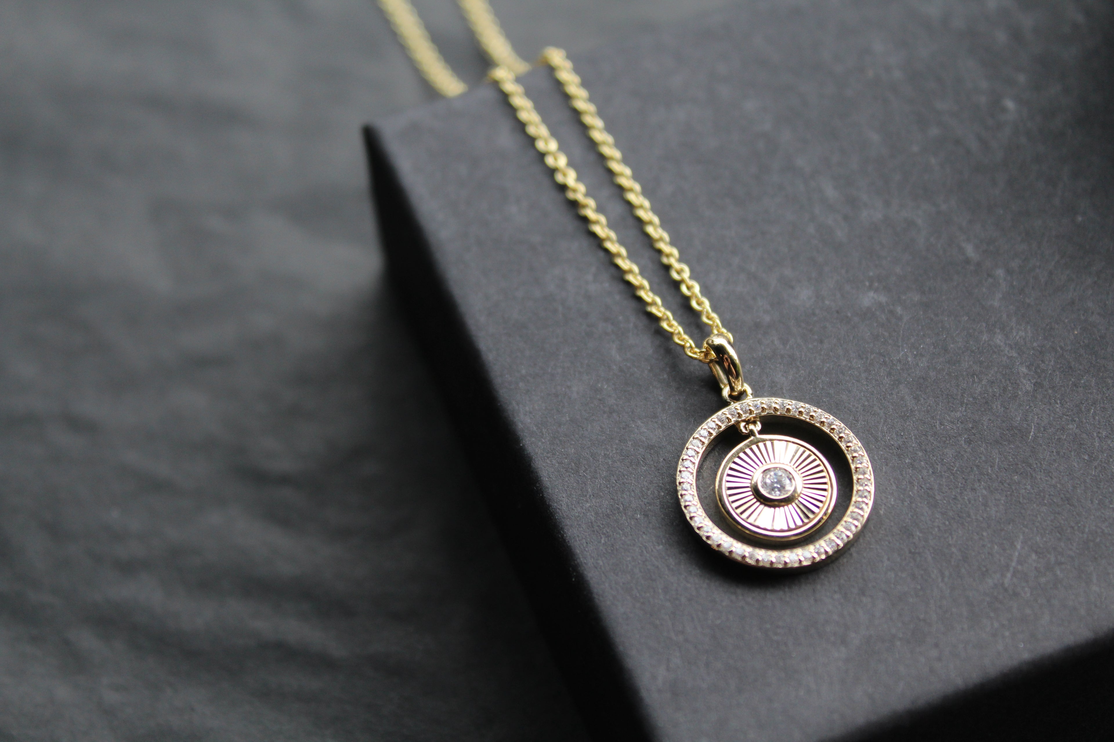 Small Sunburst Circle with Cubic Zirconia Halo Surround