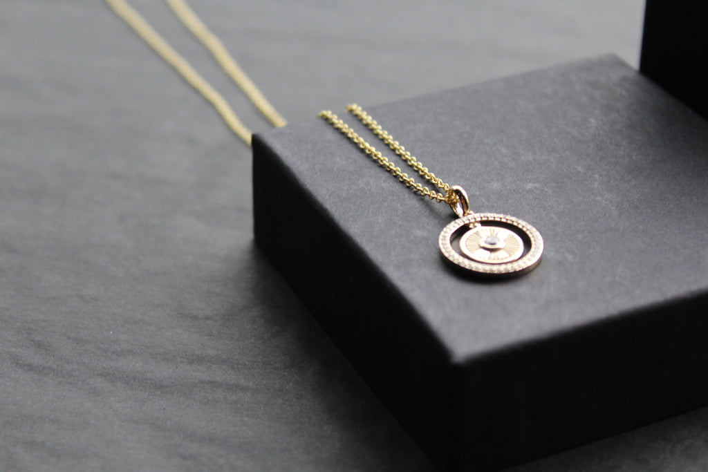 Small Sunburst Circle with Cubic Zirconia Halo Surround