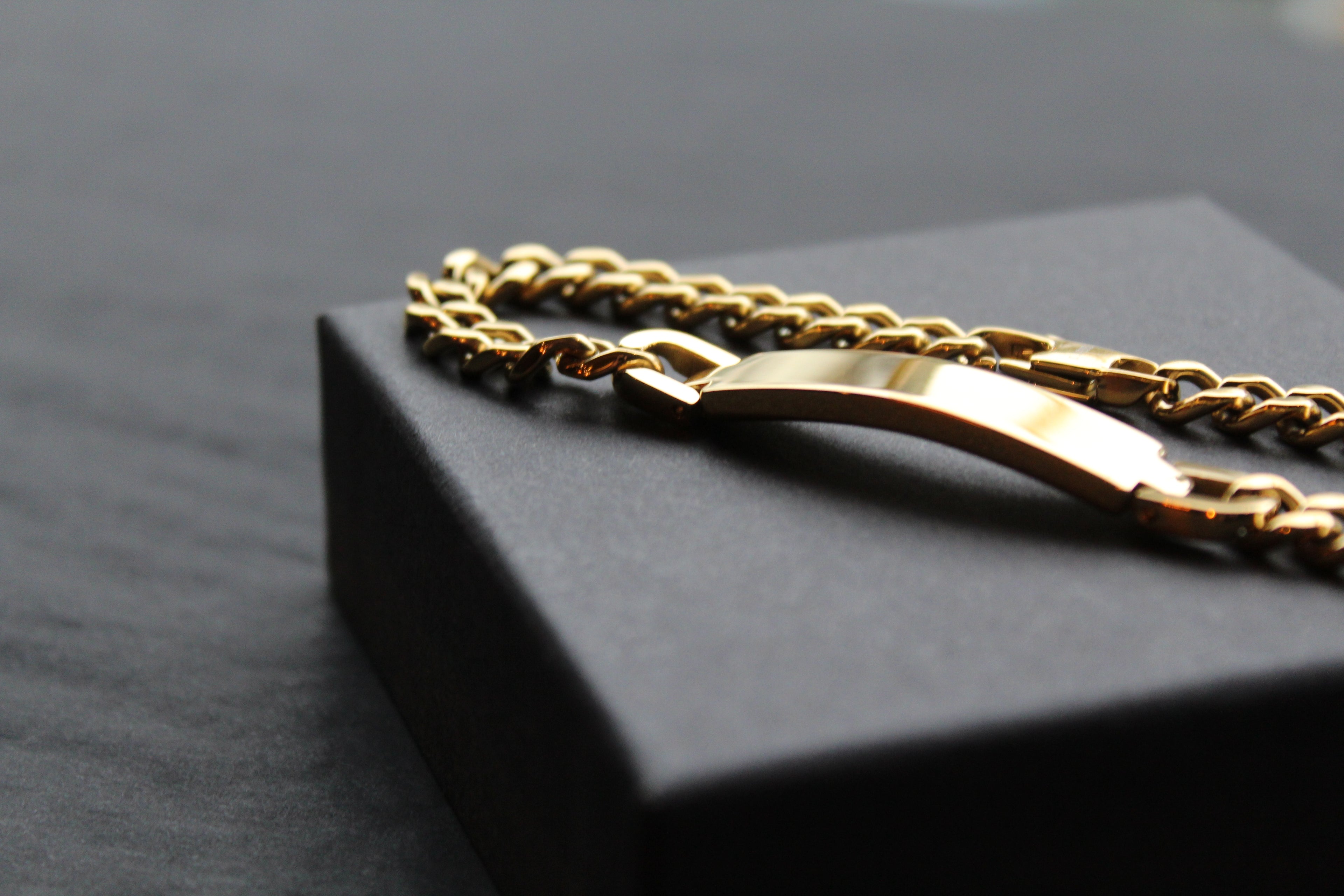 Stainless steel I.D curb bracelet with gold IP plating.