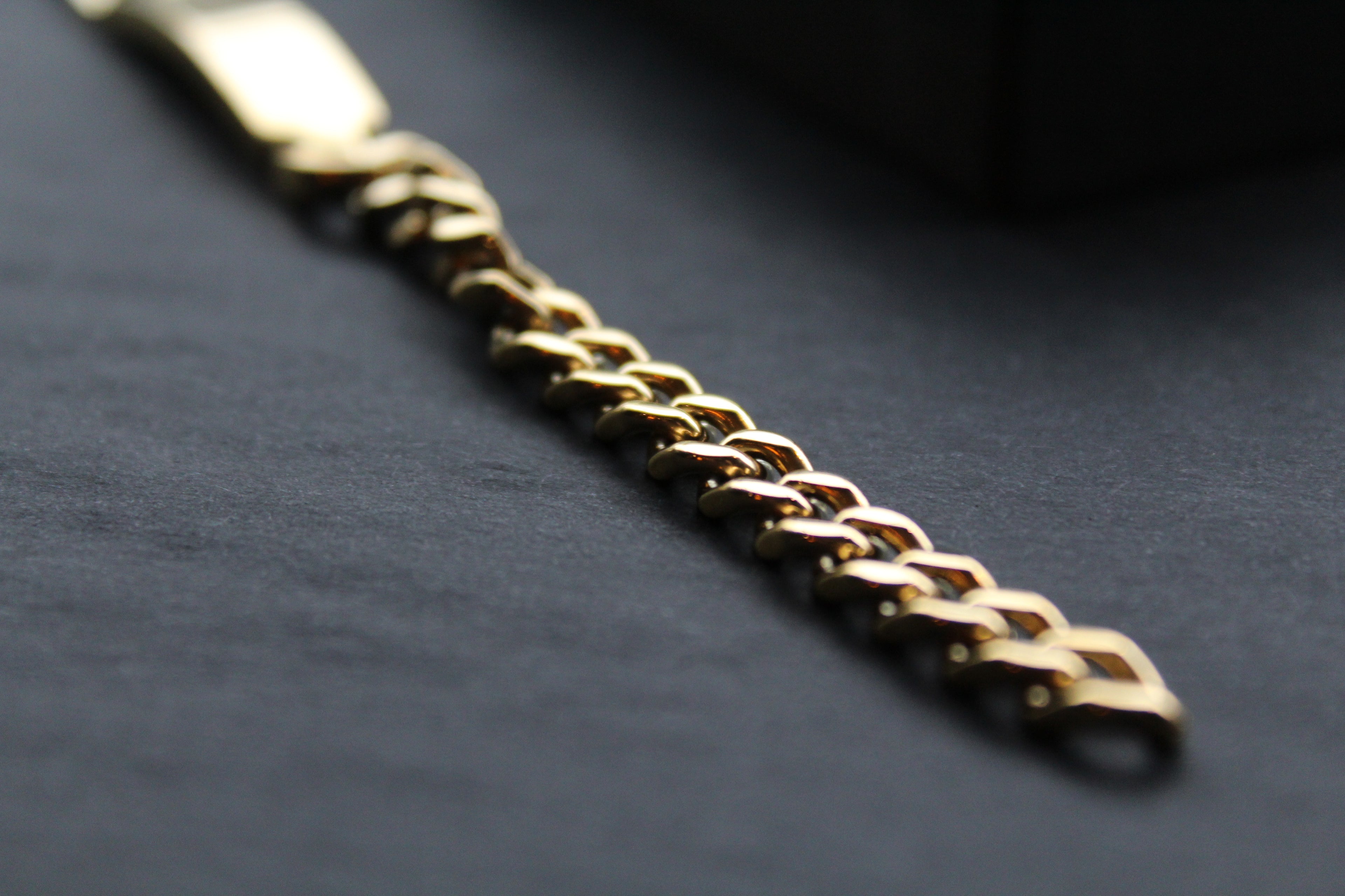 Stainless steel I.D curb bracelet with gold IP plating.