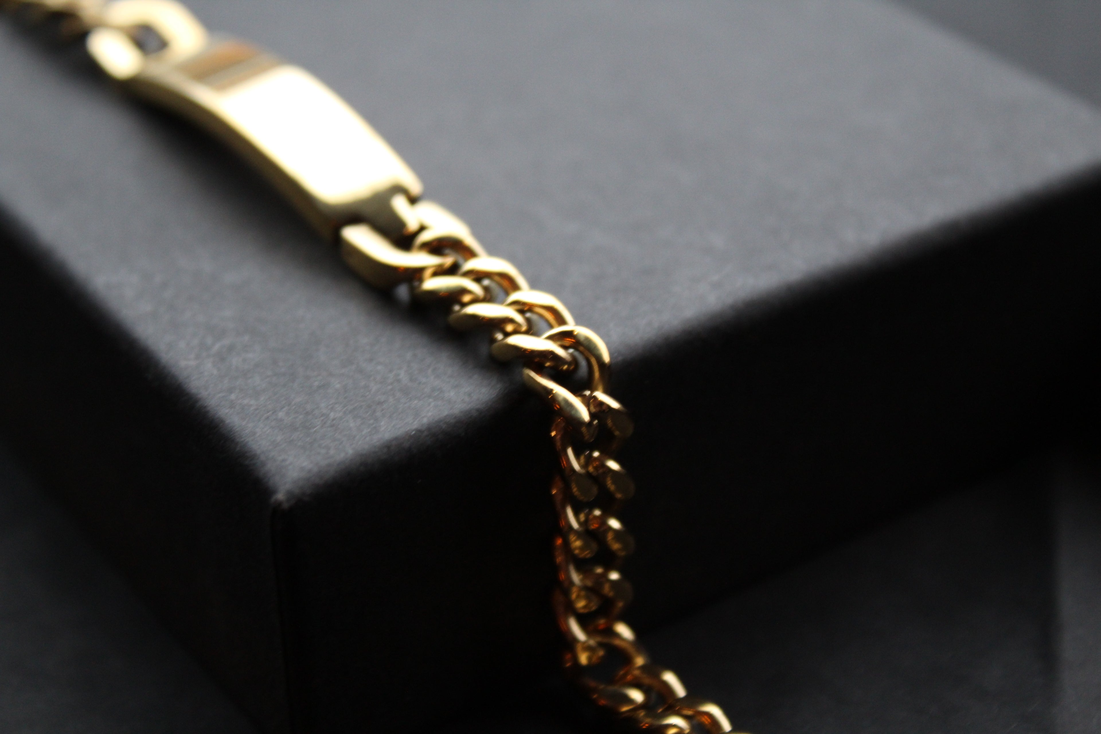 Stainless steel I.D curb bracelet with gold IP plating.