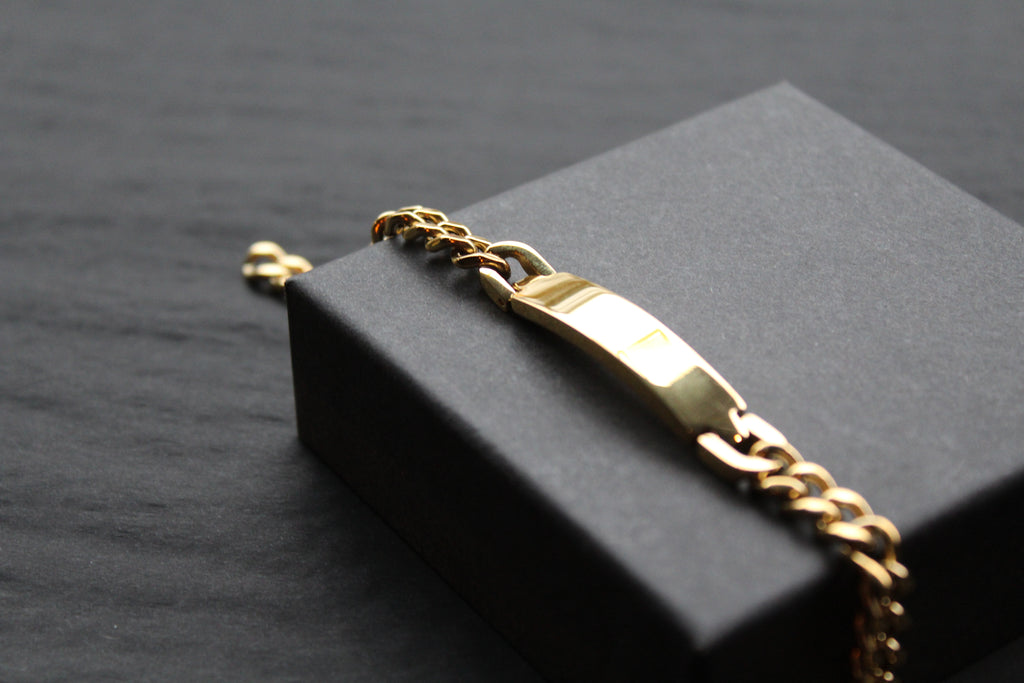 Stainless steel I.D curb bracelet with gold IP plating.