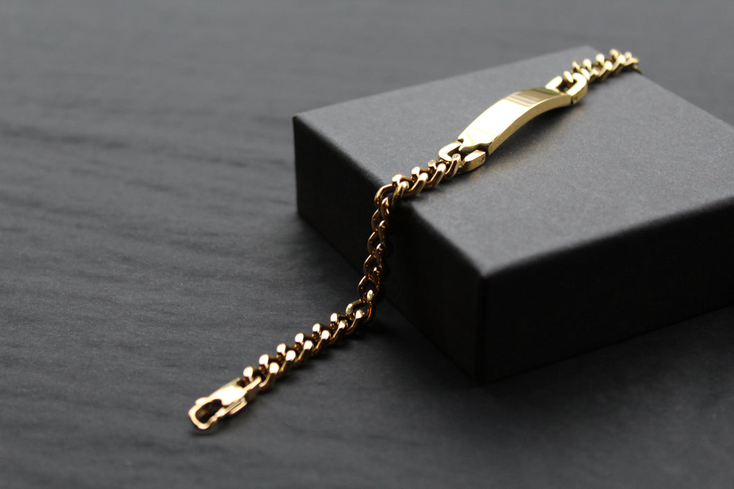 Stainless steel I.D curb bracelet with gold IP plating.
