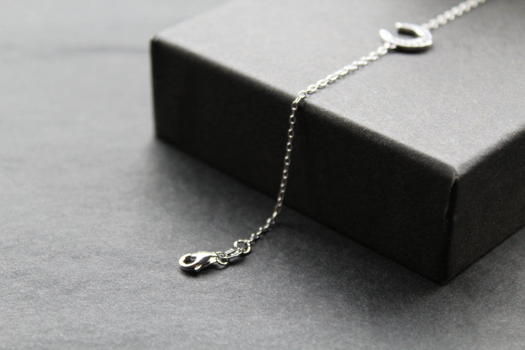 Sterling Silver Rhodium Plated CZ Horseshoe Bracelet