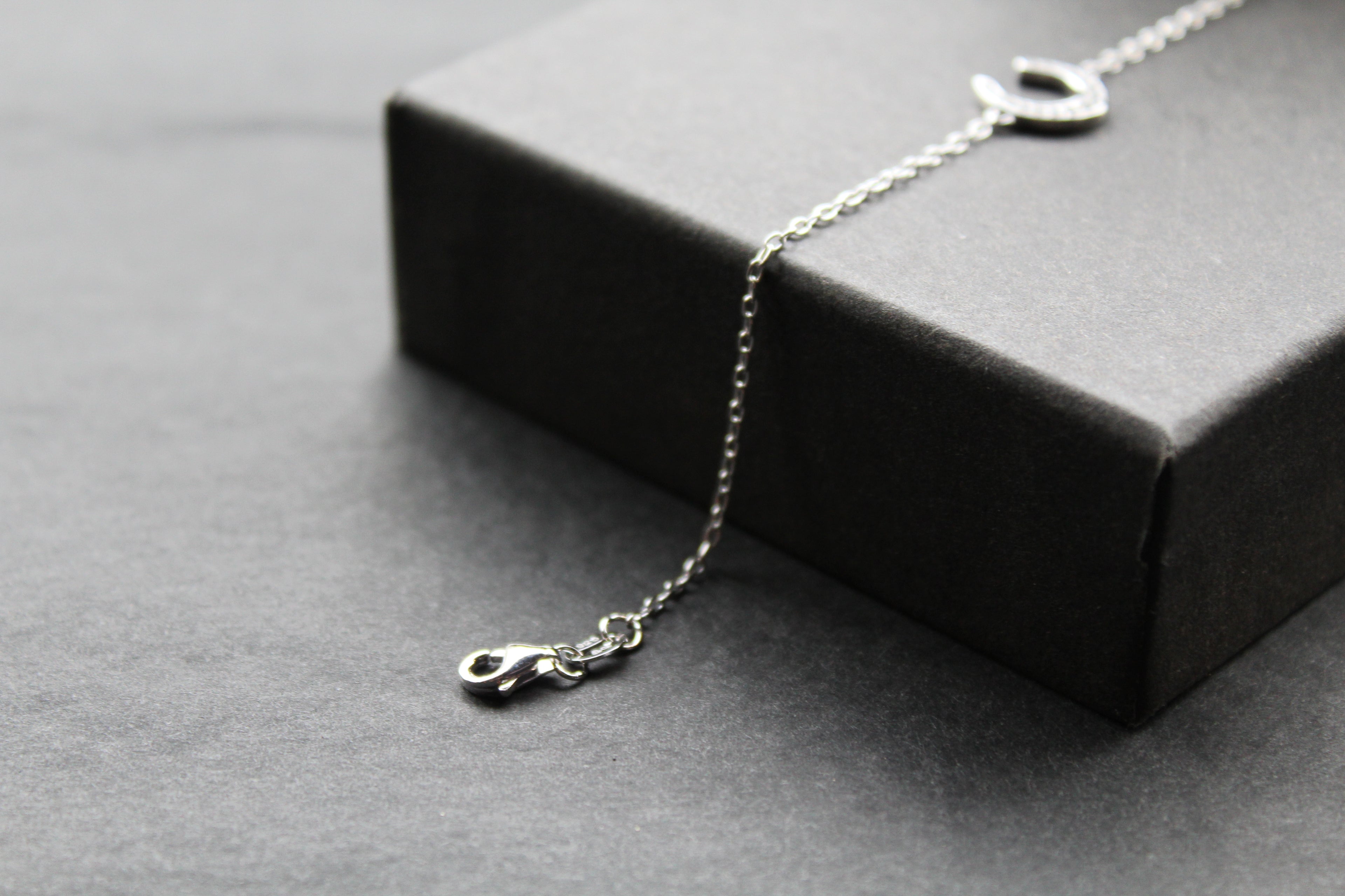 Sterling Silver Rhodium Plated CZ Horseshoe Bracelet