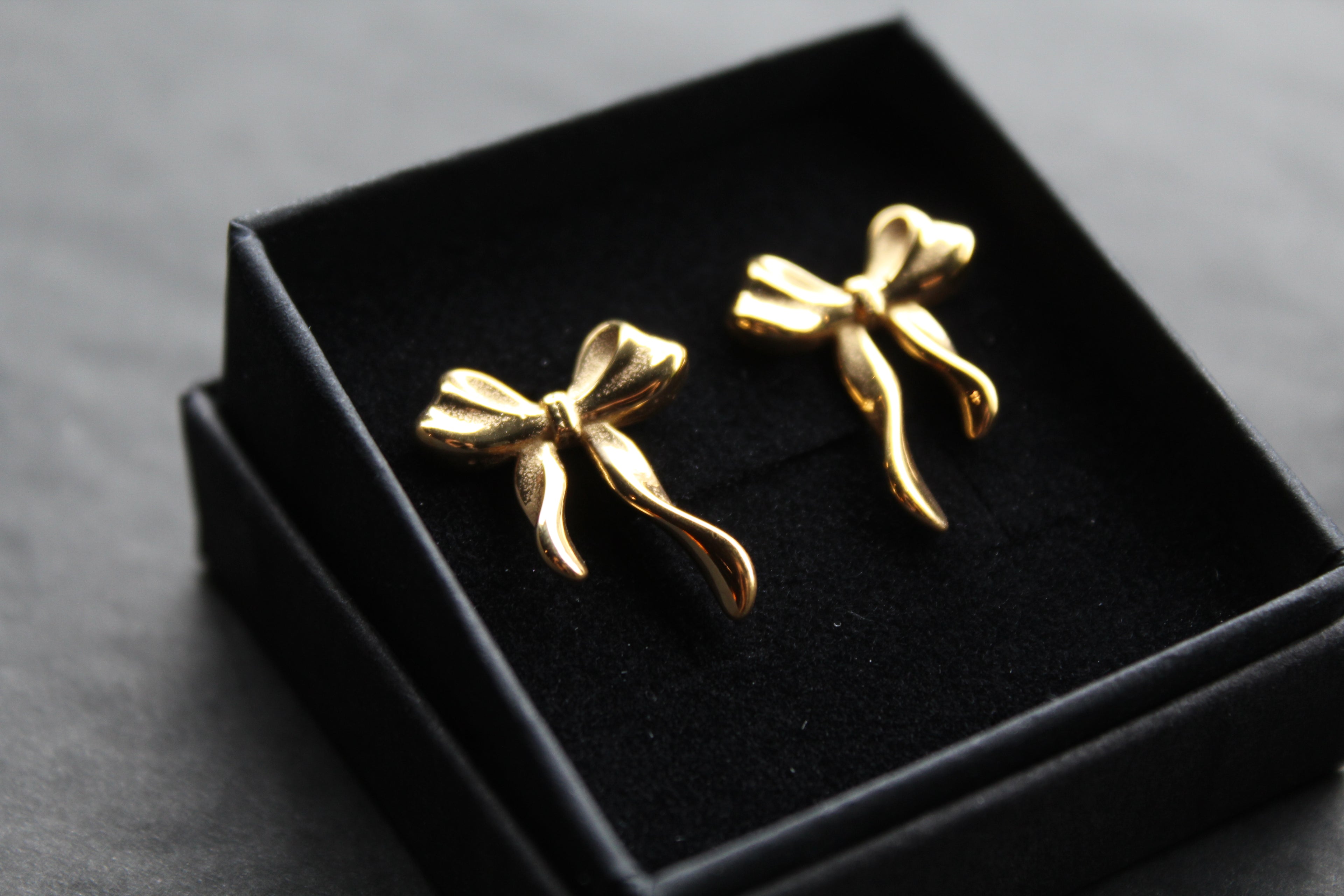 The Serenity Ribbon Bow Dainty Stud Earrings