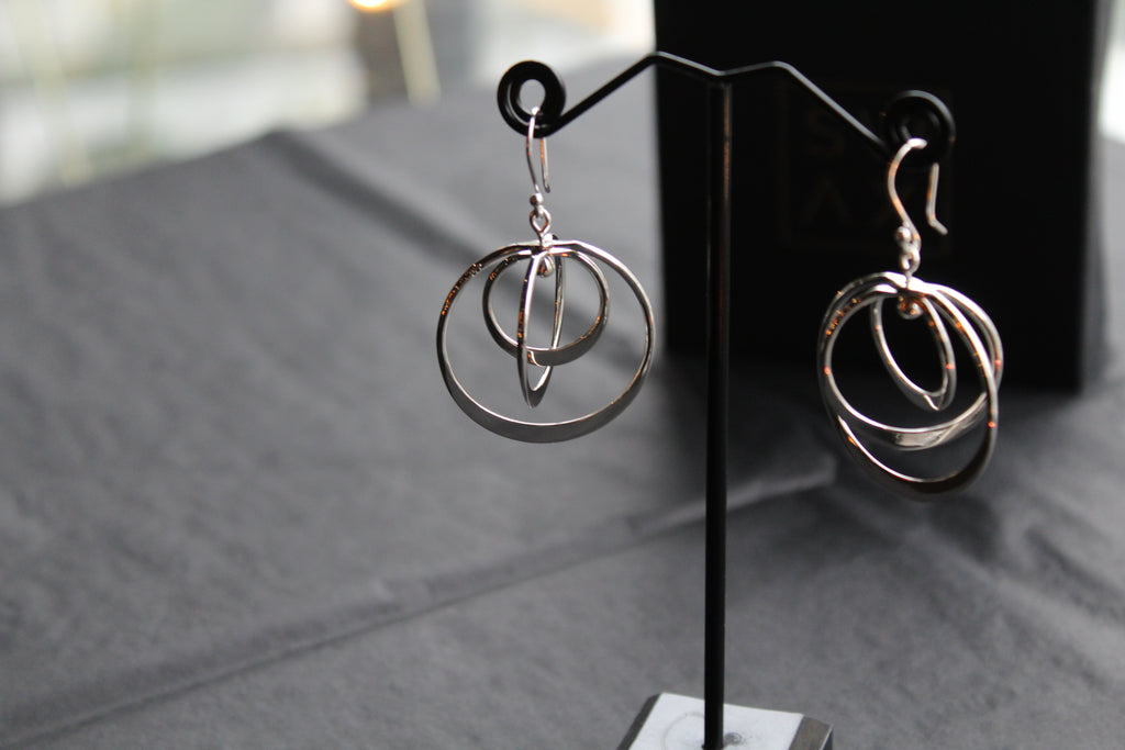 Twirling Silver Hoops Earrings