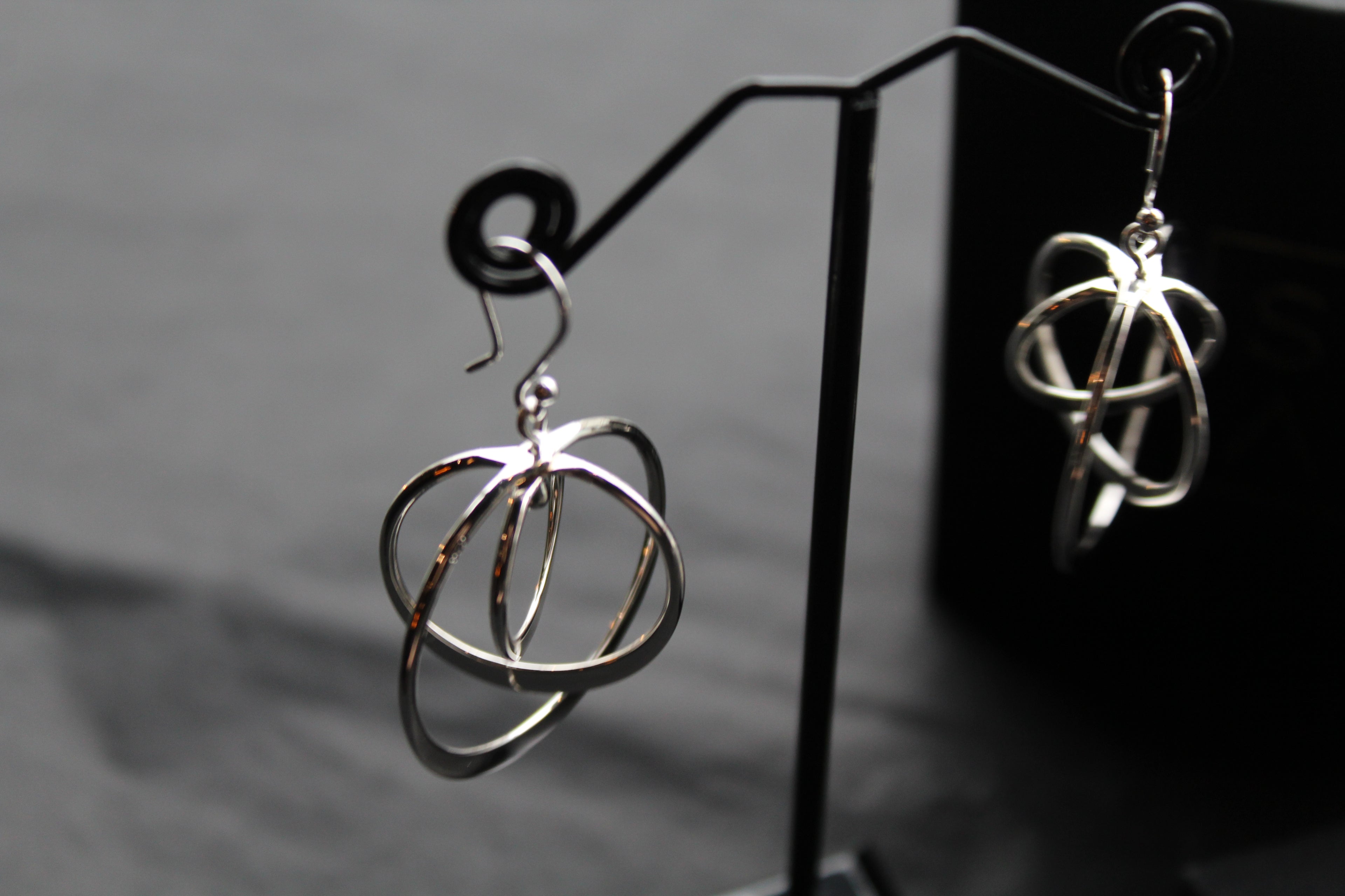 Twirling Silver Hoops Earrings