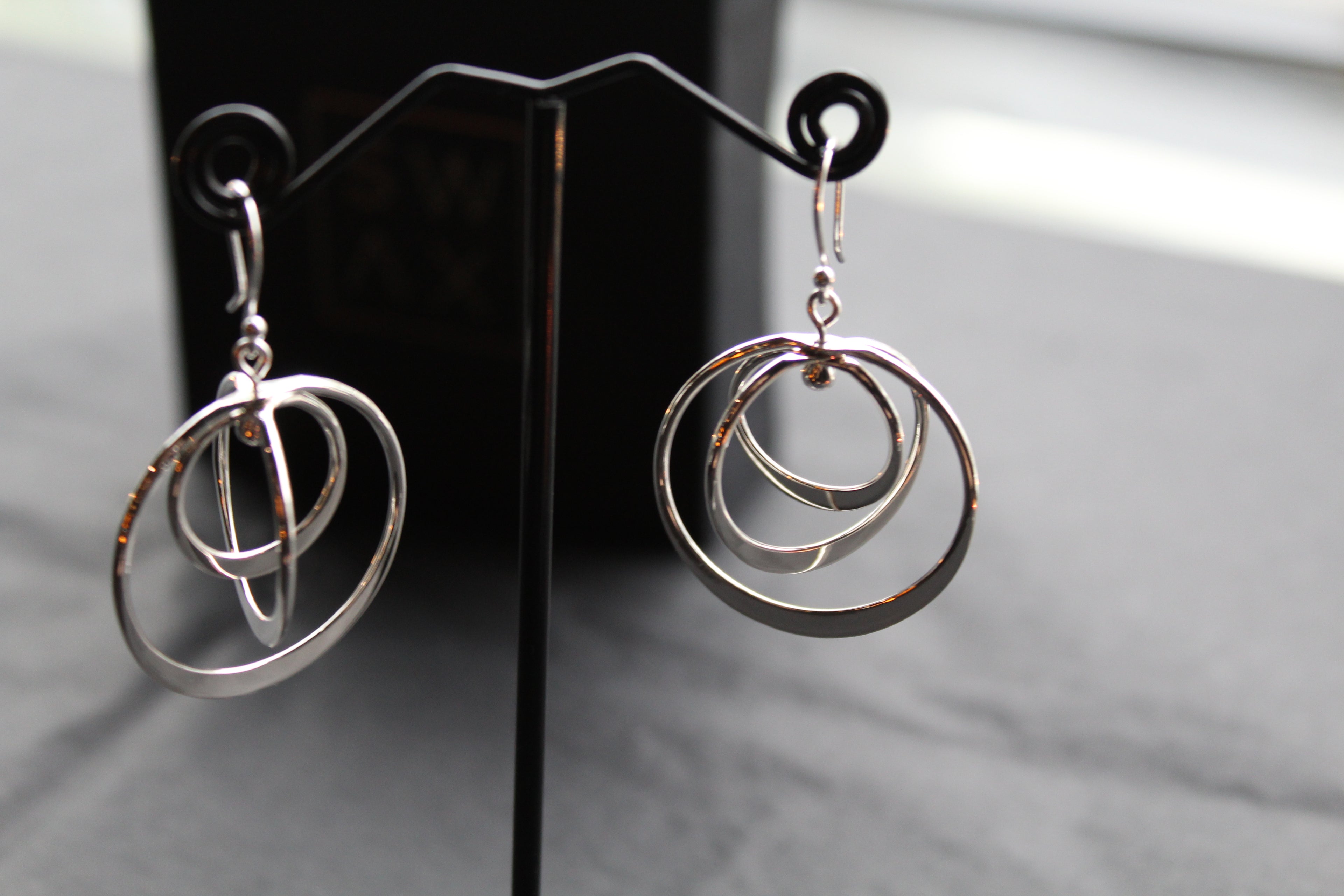 Twirling Silver Hoops Earrings