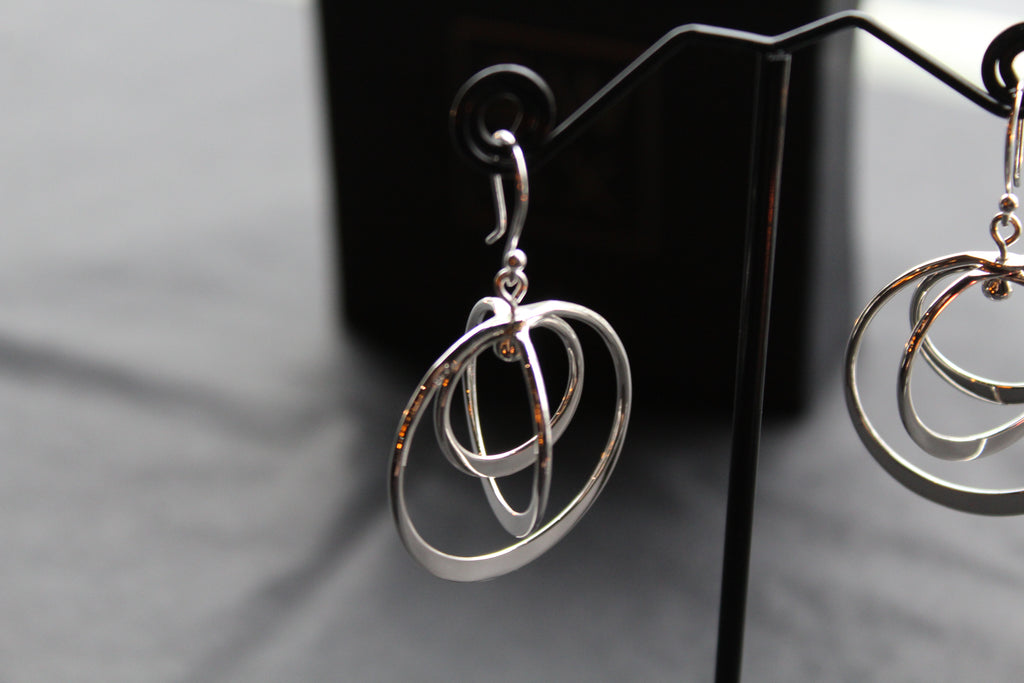 Twirling Silver Hoops Earrings