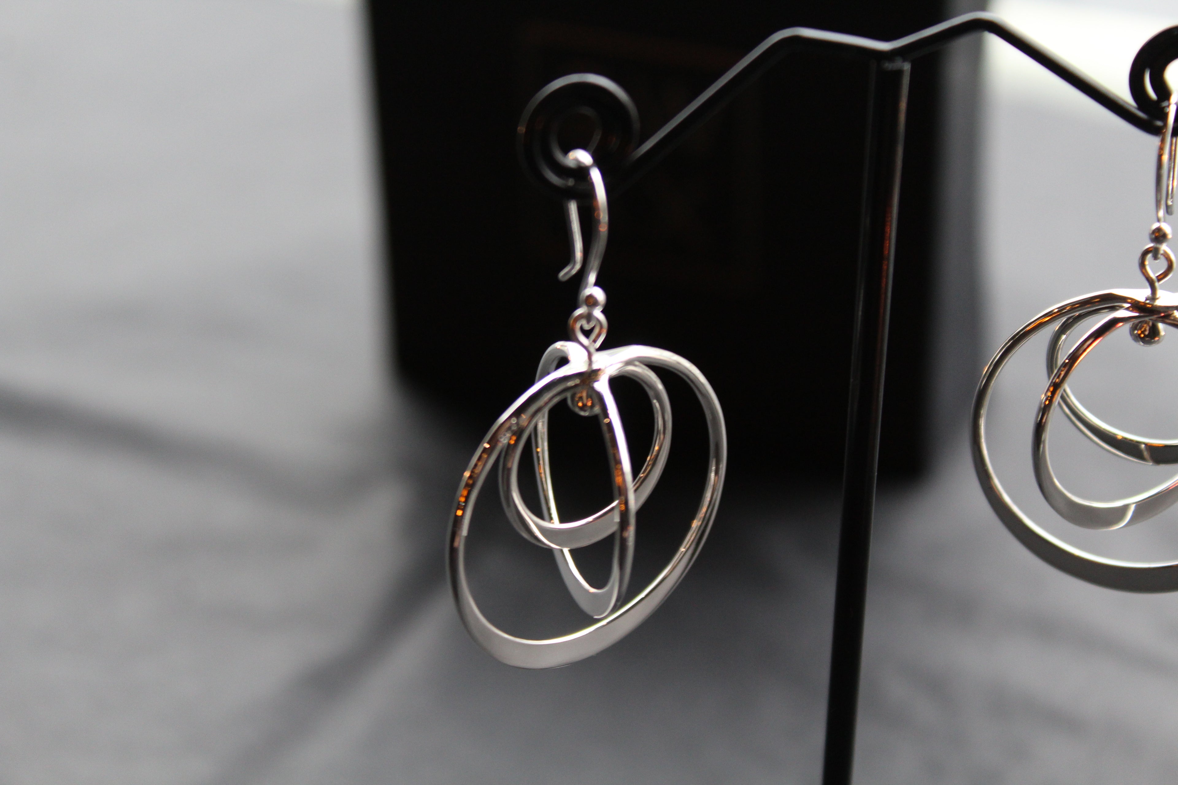 Twirling Silver Hoops Earrings