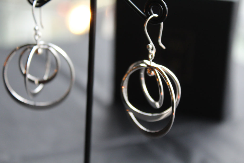 Twirling Silver Hoops Earrings