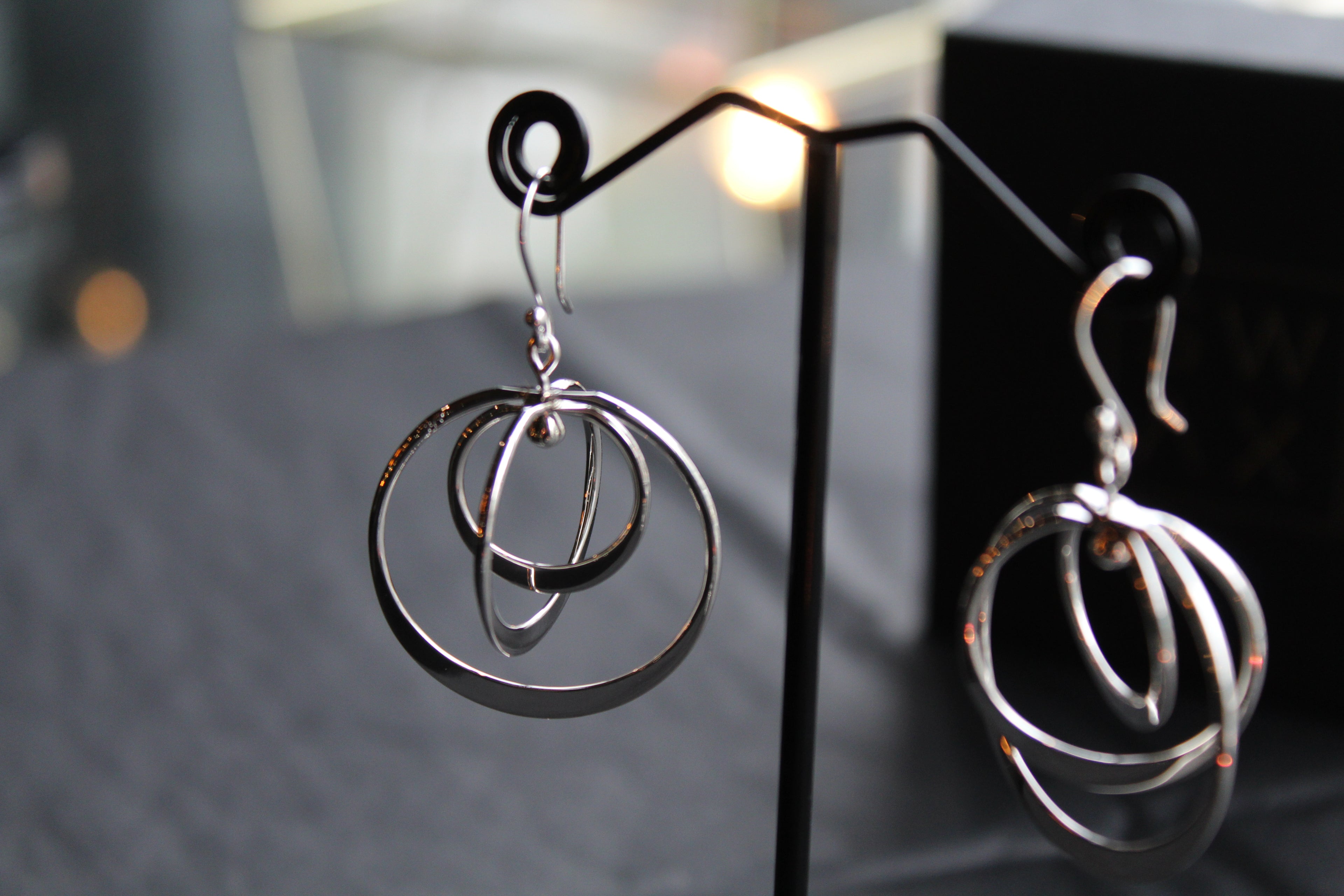 Twirling Silver Hoops Earrings
