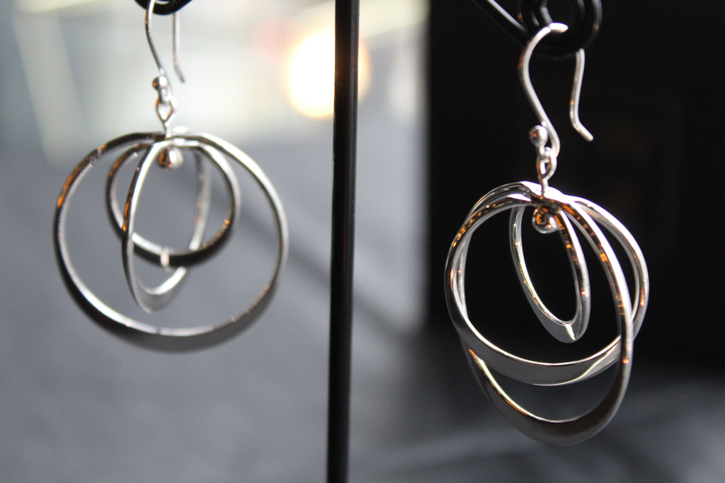 Twirling Silver Hoops Earrings