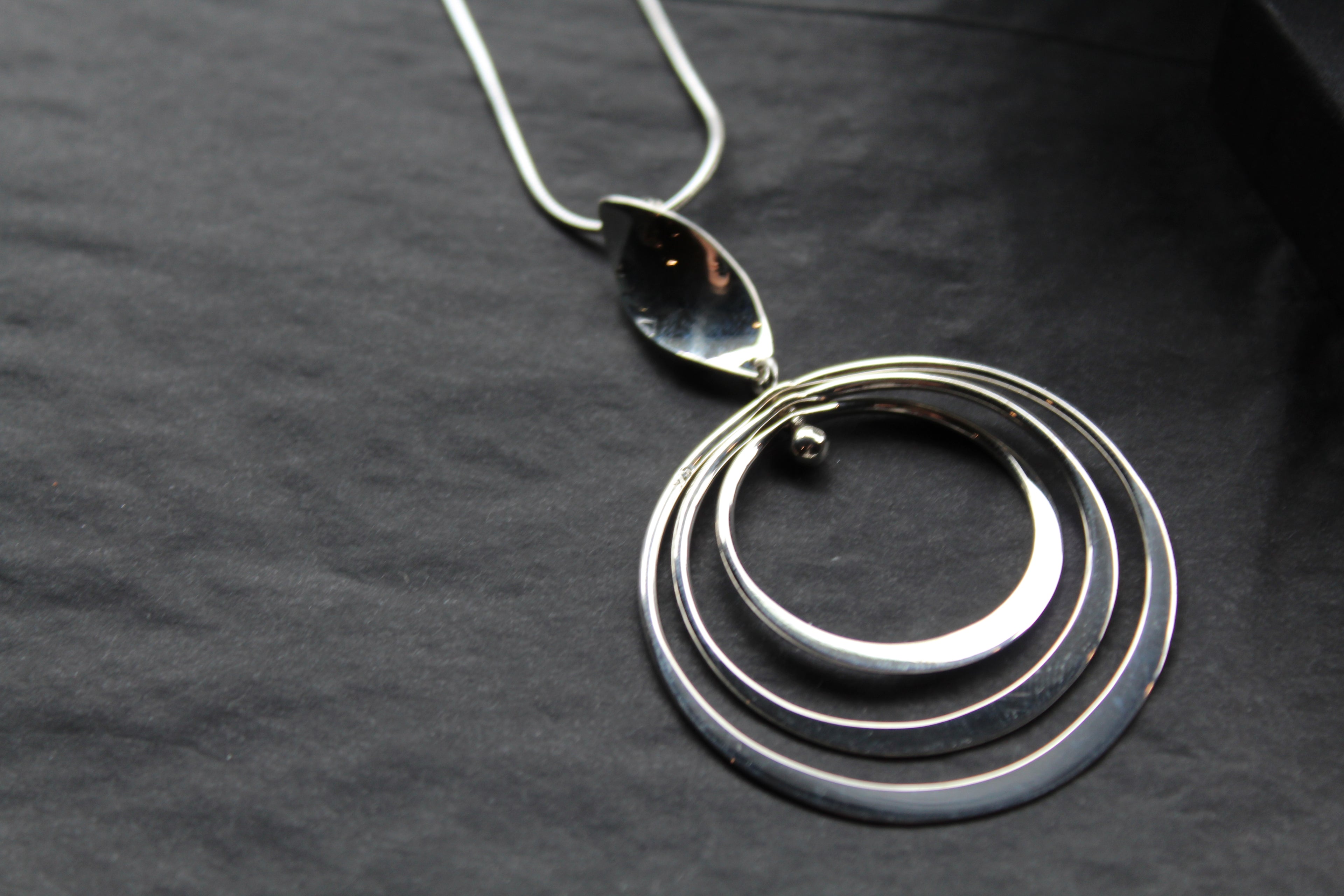 Twirling Silver Hoops Pendant with 18 - 20" Silver Chain