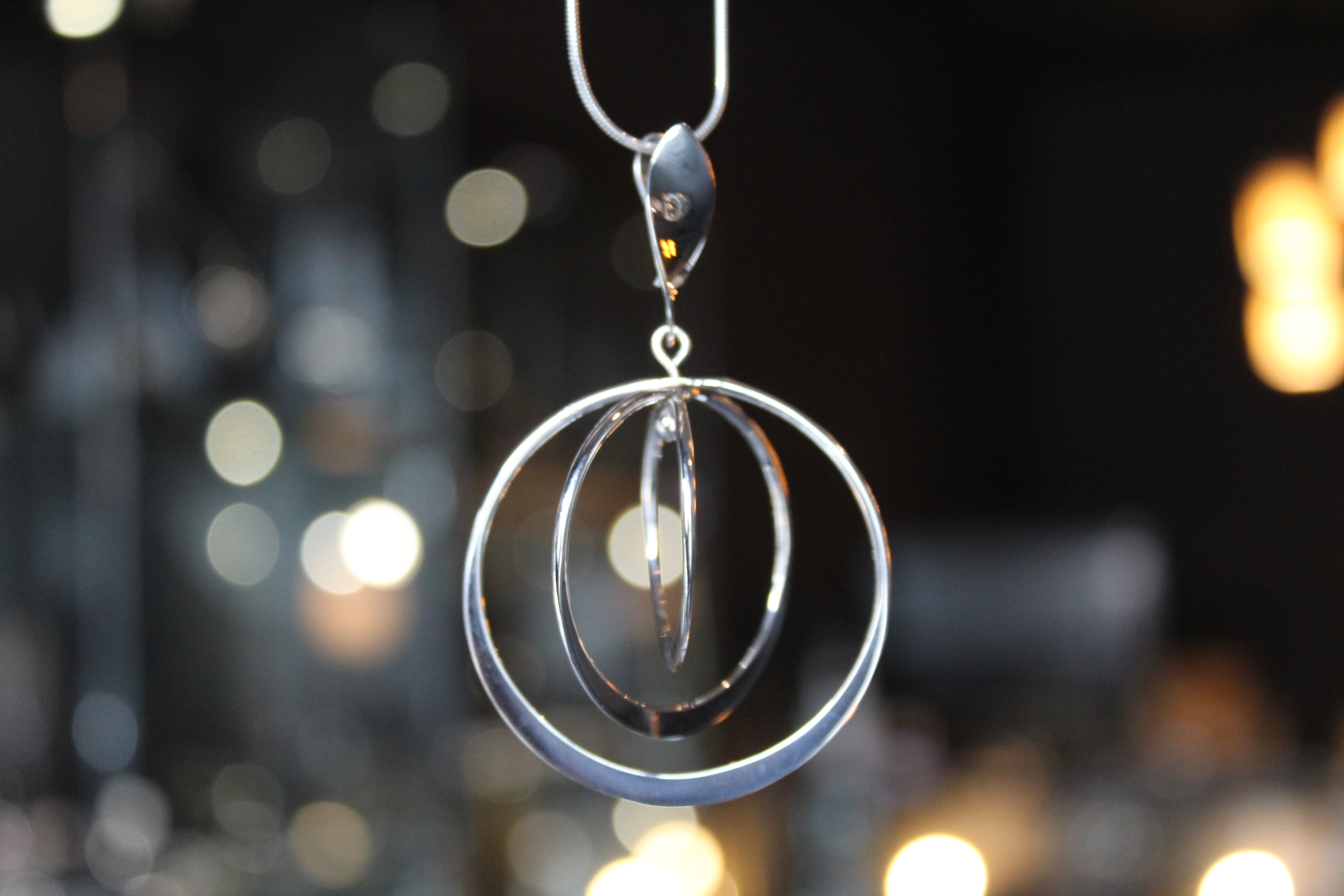 Twirling Silver Hoops Pendant with 18 - 20" Silver Chain