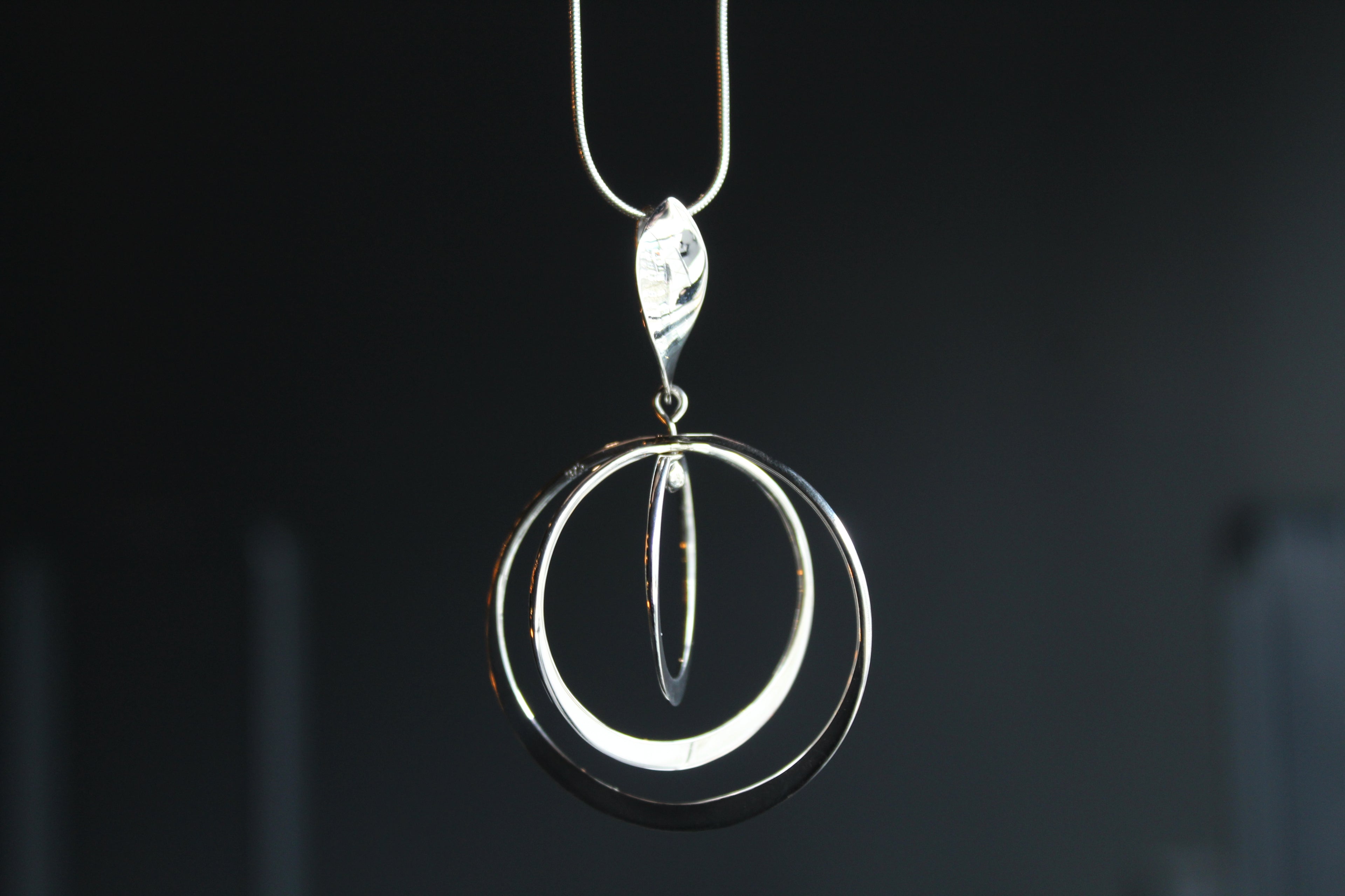 Twirling Silver Hoops Pendant with 18 - 20" Silver Chain