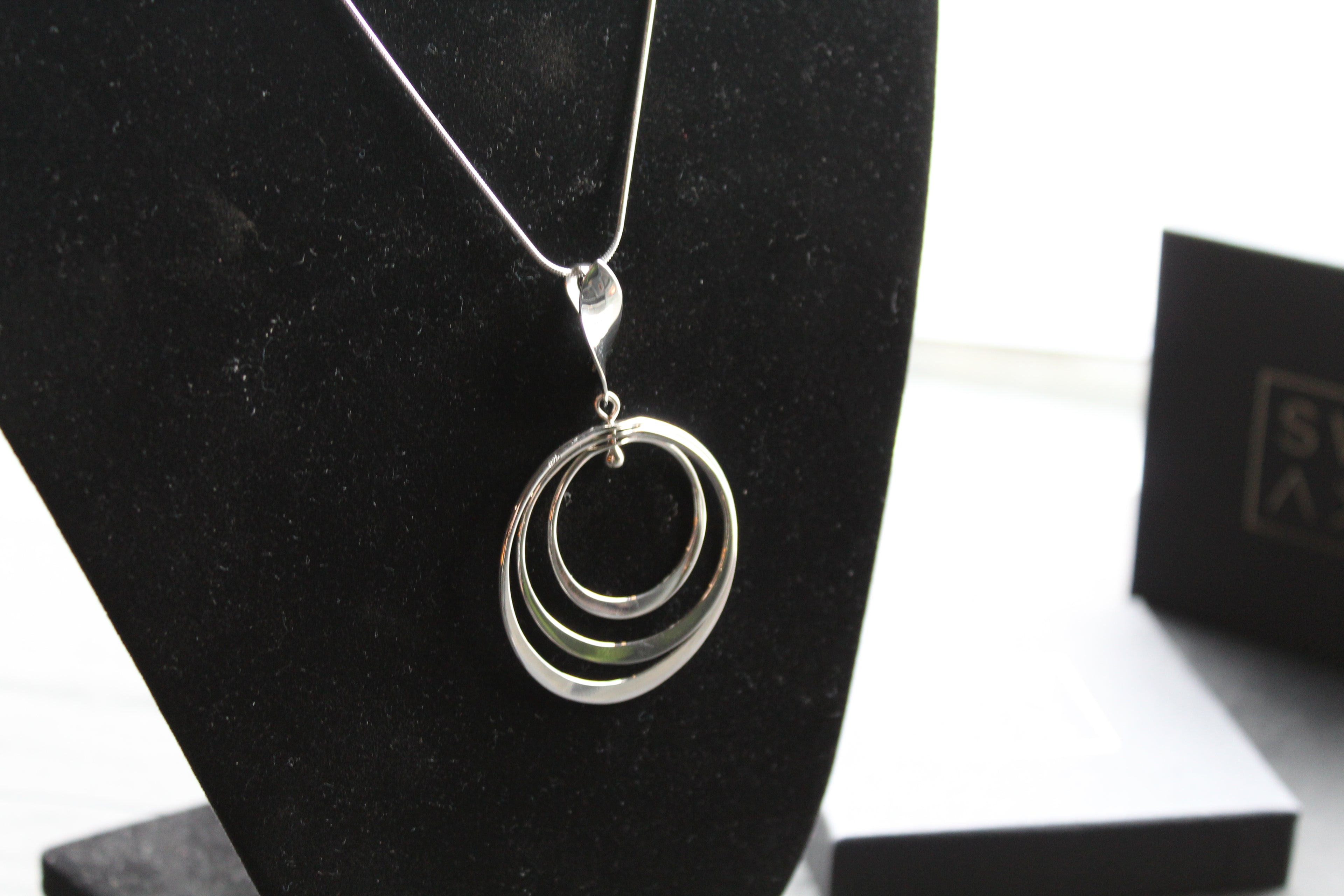 Twirling Silver Hoops Pendant with 18 - 20" Silver Chain
