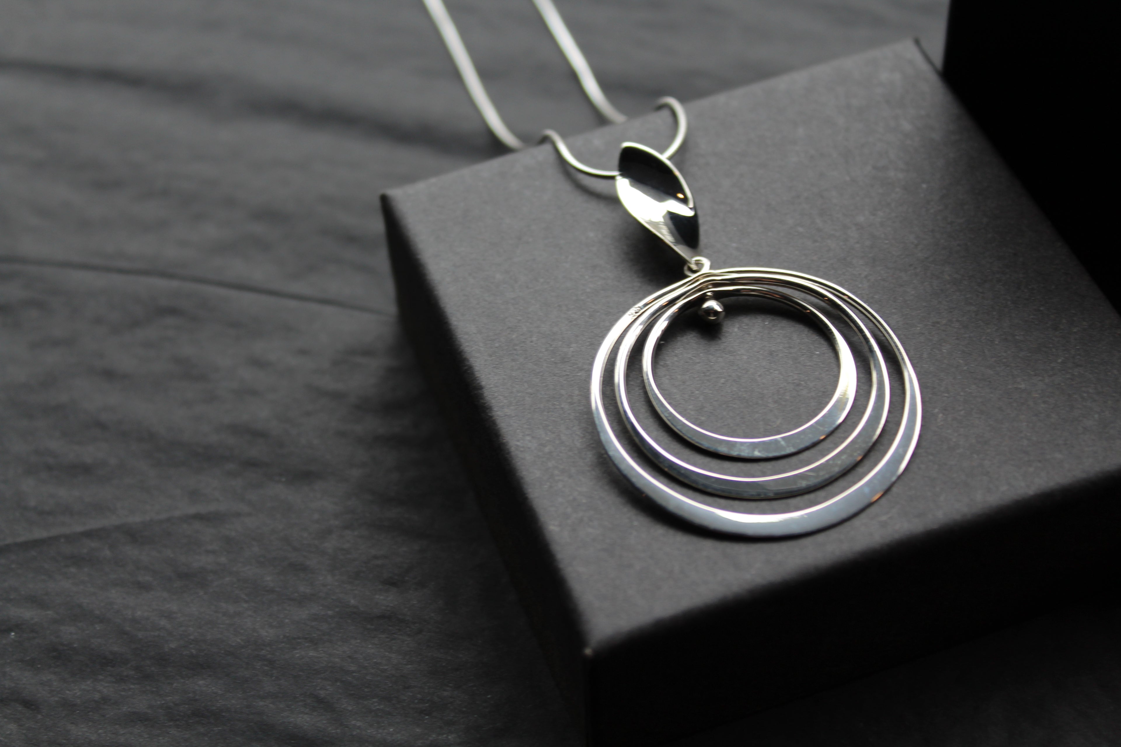 Twirling Silver Hoops Pendant with 18 - 20" Silver Chain