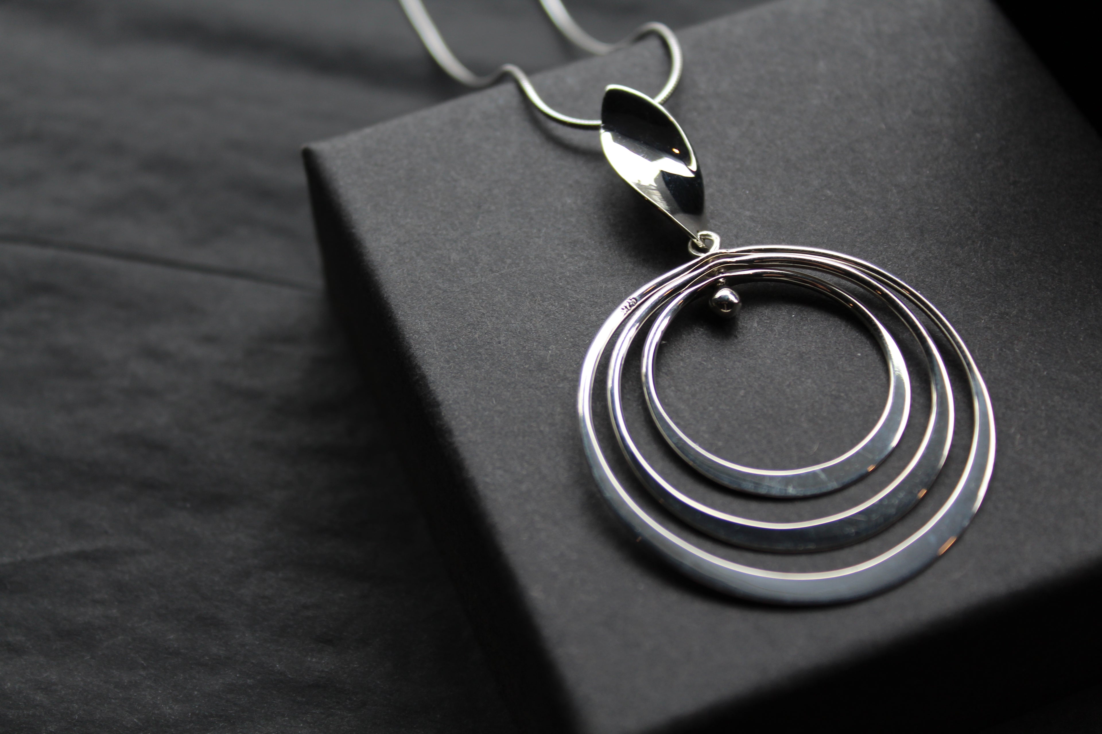 Twirling Silver Hoops Pendant with 18 - 20" Silver Chain