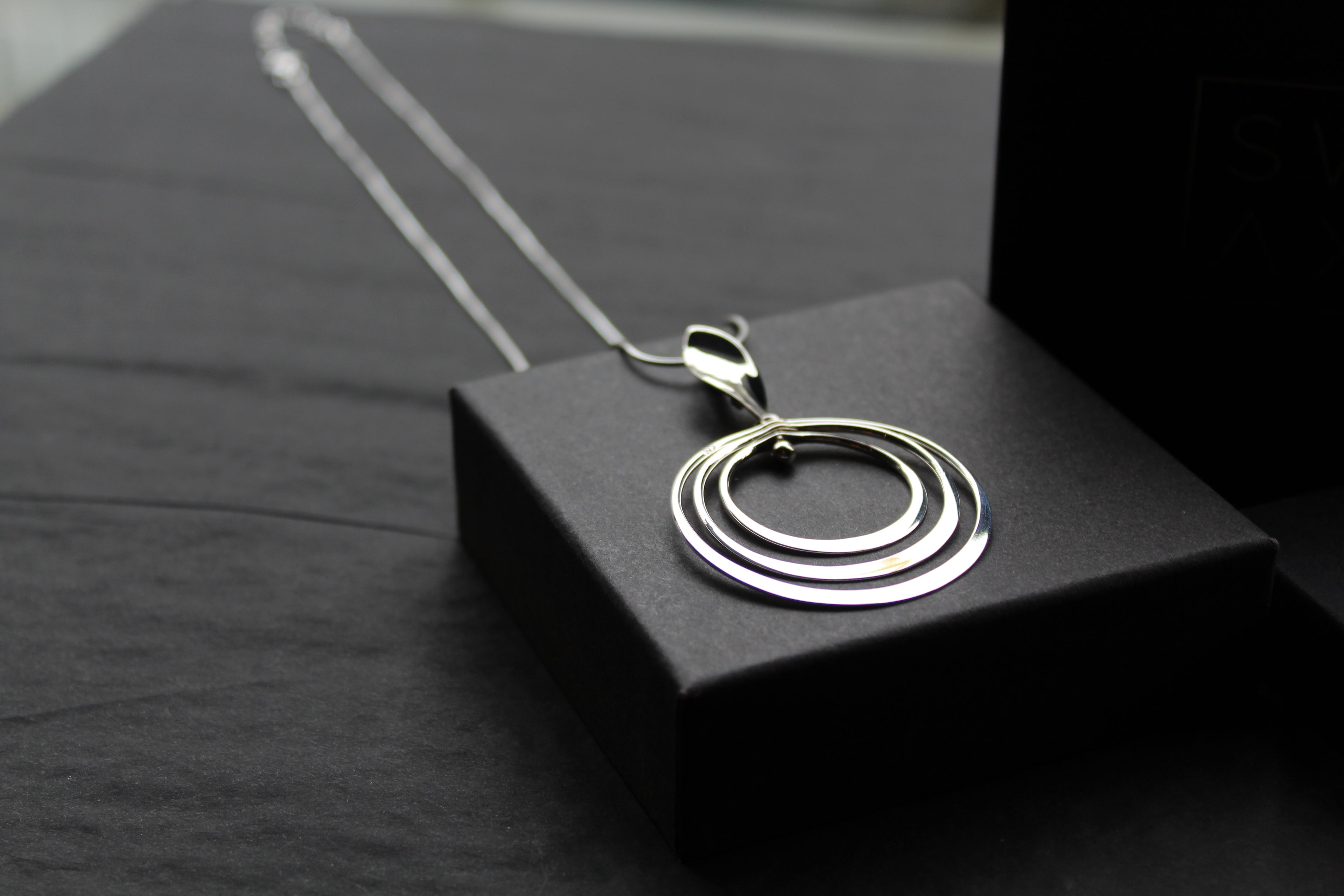 Twirling Silver Hoops Pendant with 18 - 20" Silver Chain