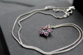 Pink Diamond Cubic Zirconia Flower Pendant with a 16-18" Silver Chain