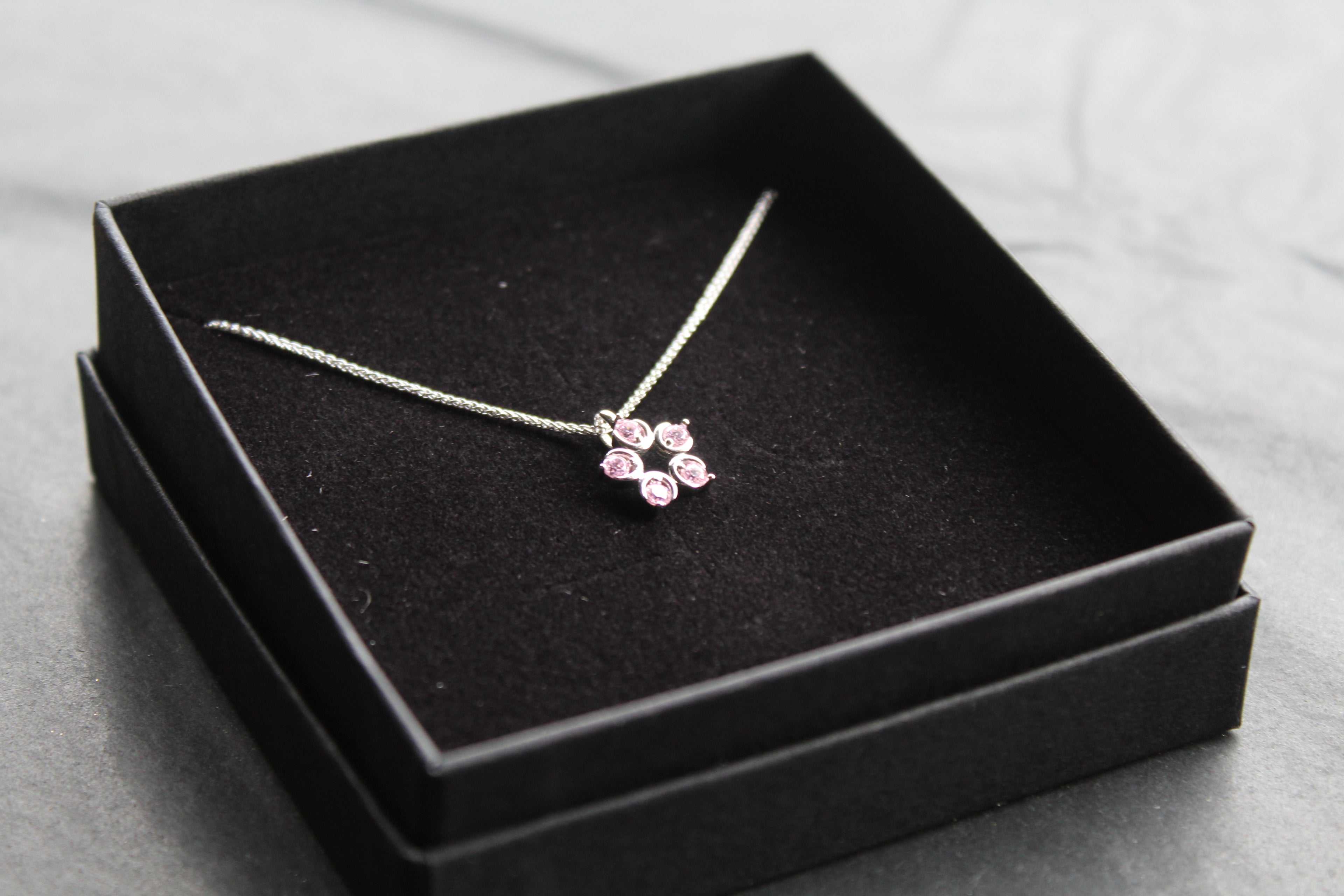 Pink Diamond Cubic Zirconia Flower Pendant with a 16-18" Silver Chain
