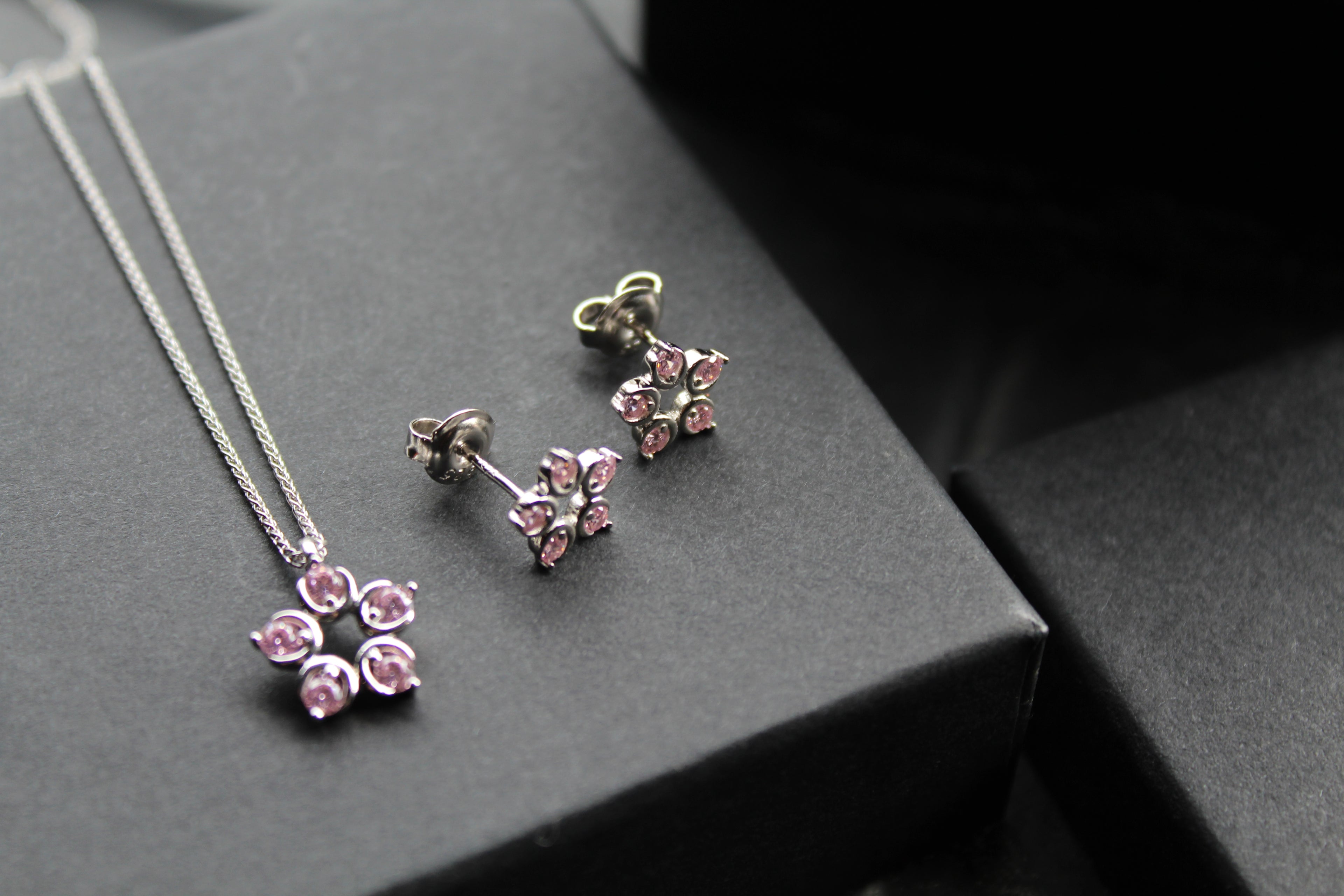 Pink Diamond Cubic Zirconia Flower Pendant with a 16-18" Silver Chain