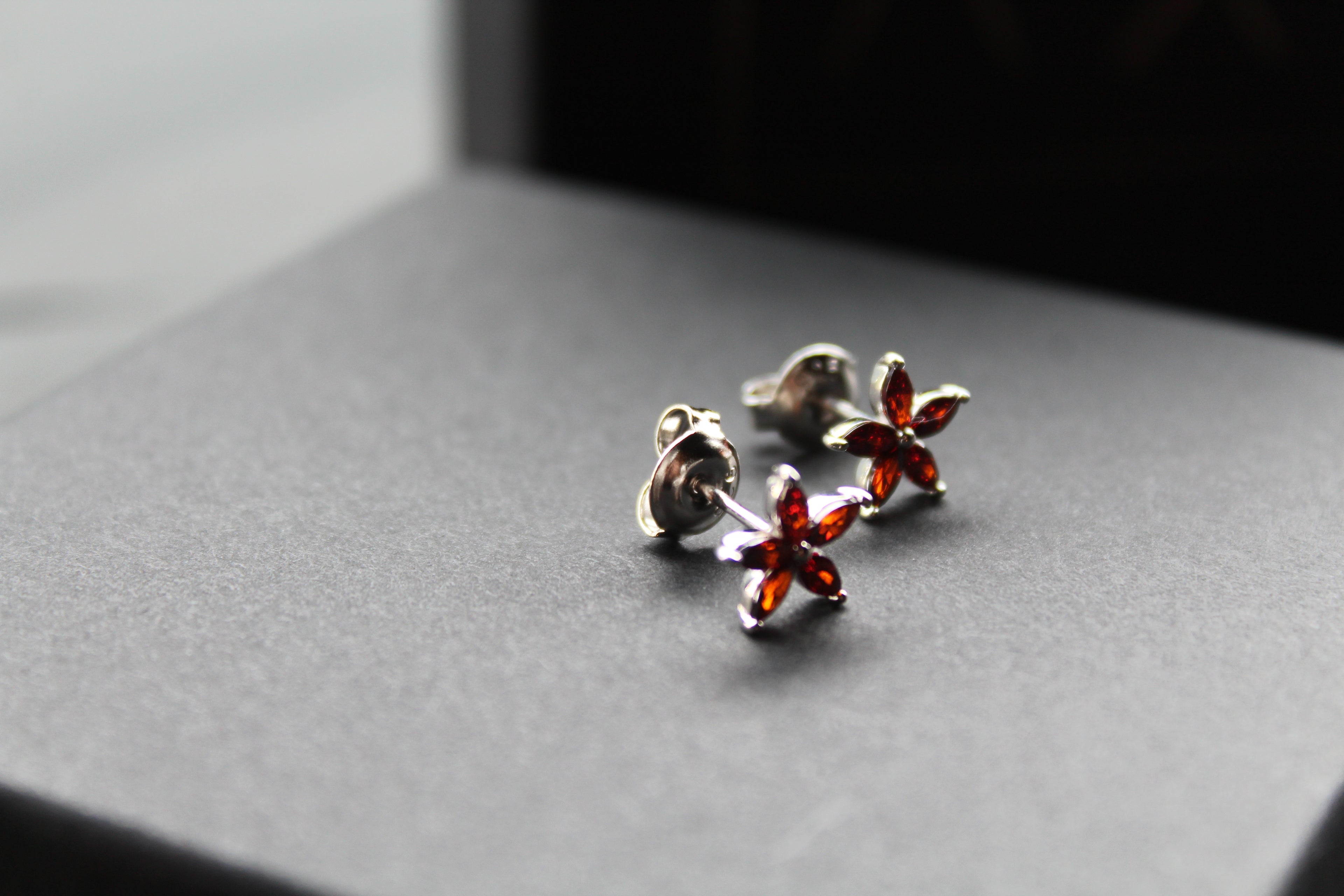 Ruby CZ Star Flower Earrings