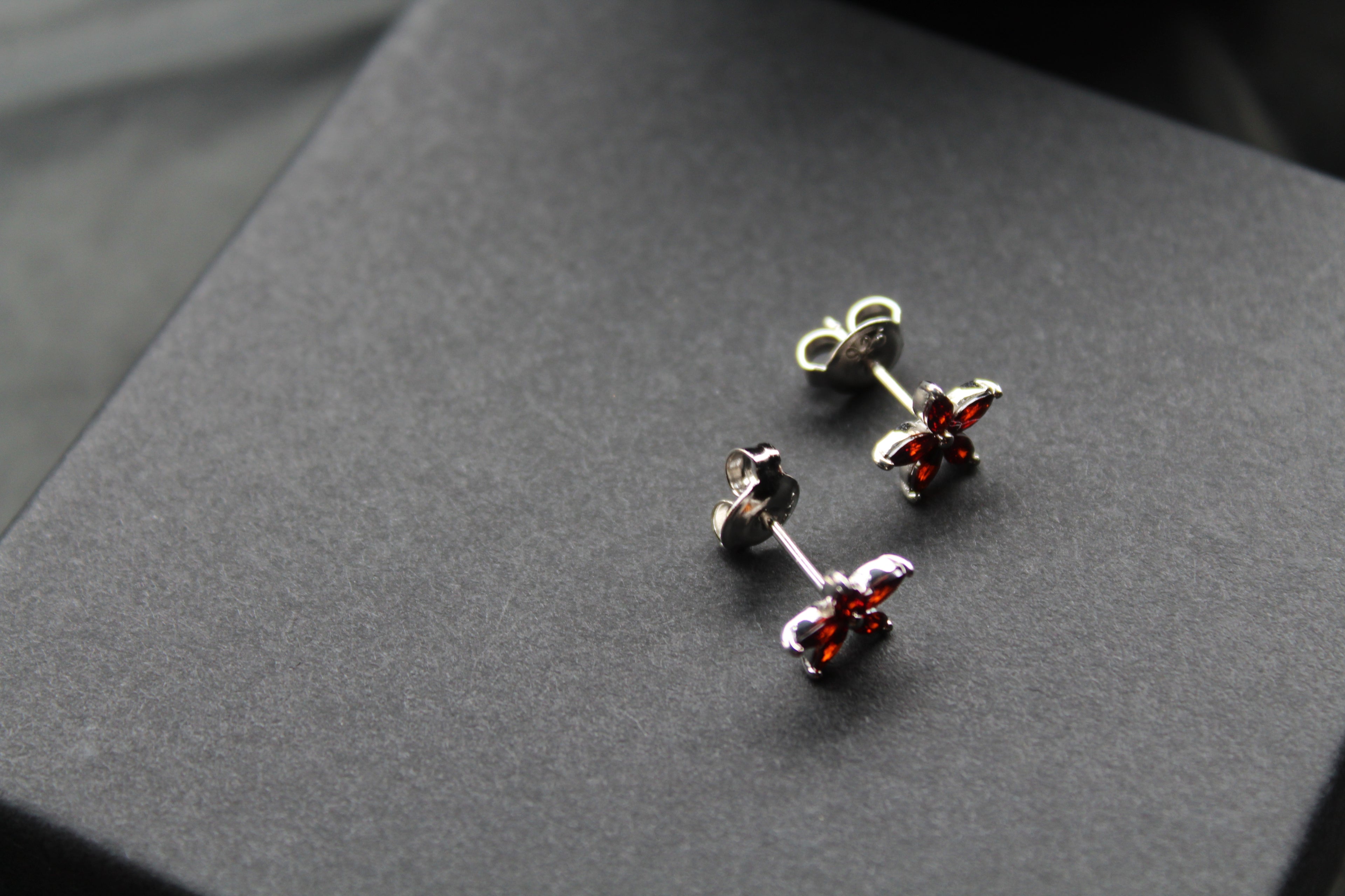 Ruby CZ Star Flower Earrings