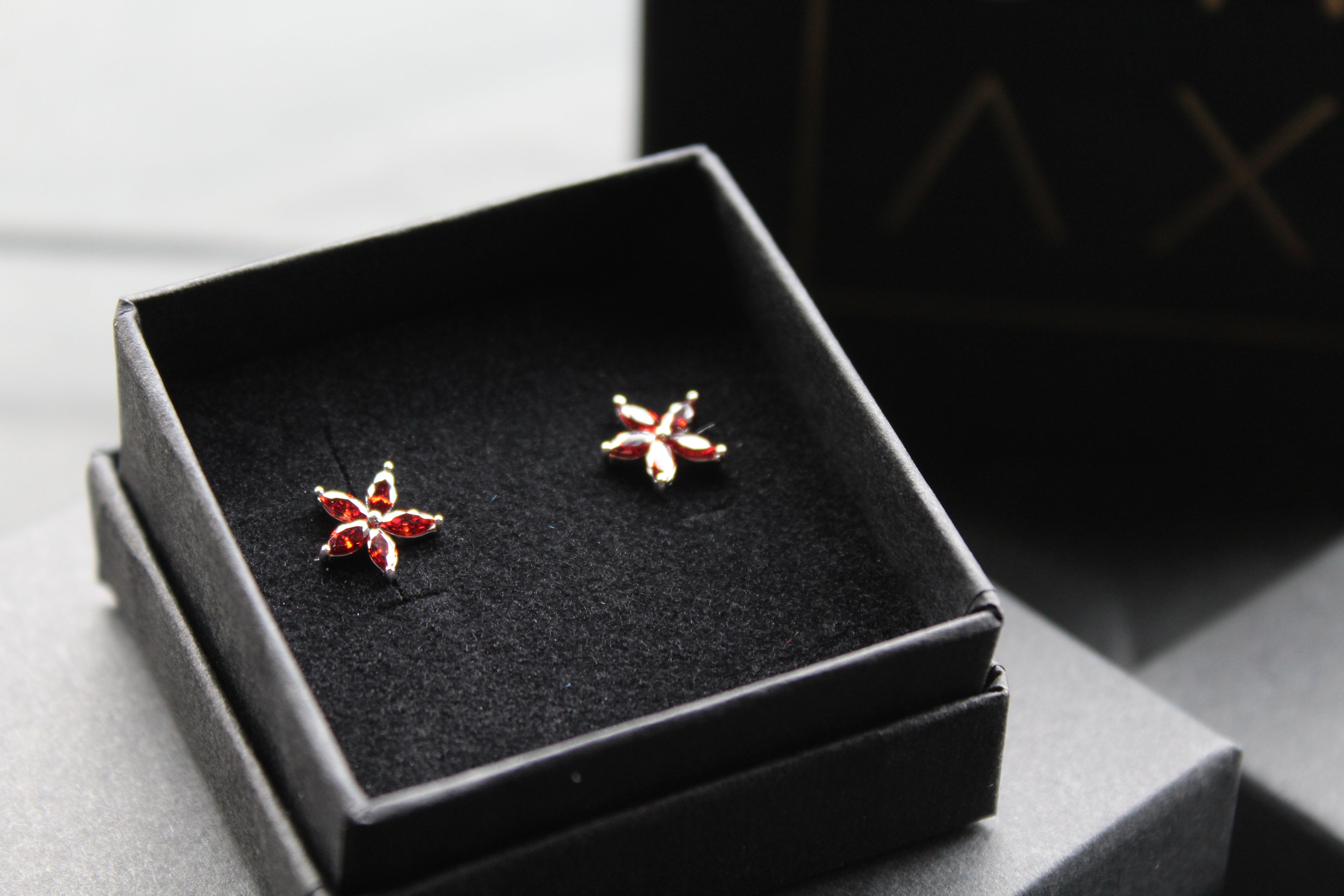 Ruby CZ Star Flower Earrings