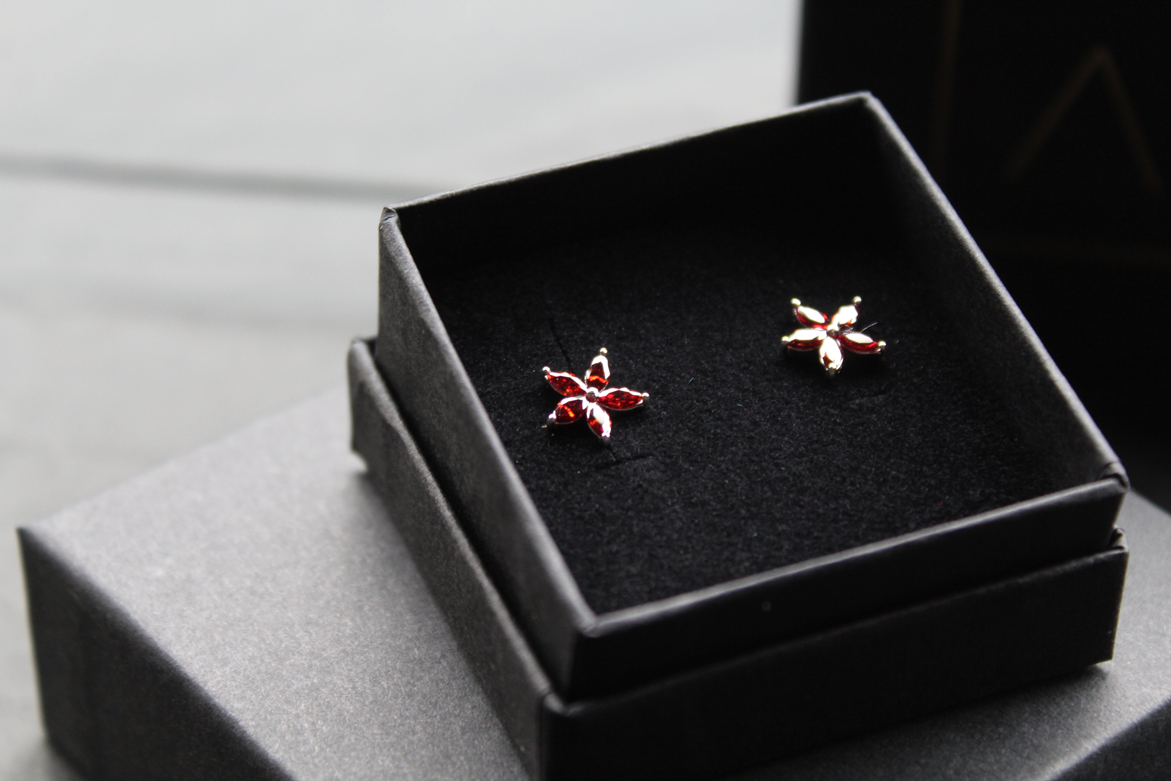 Ruby CZ Star Flower Earrings