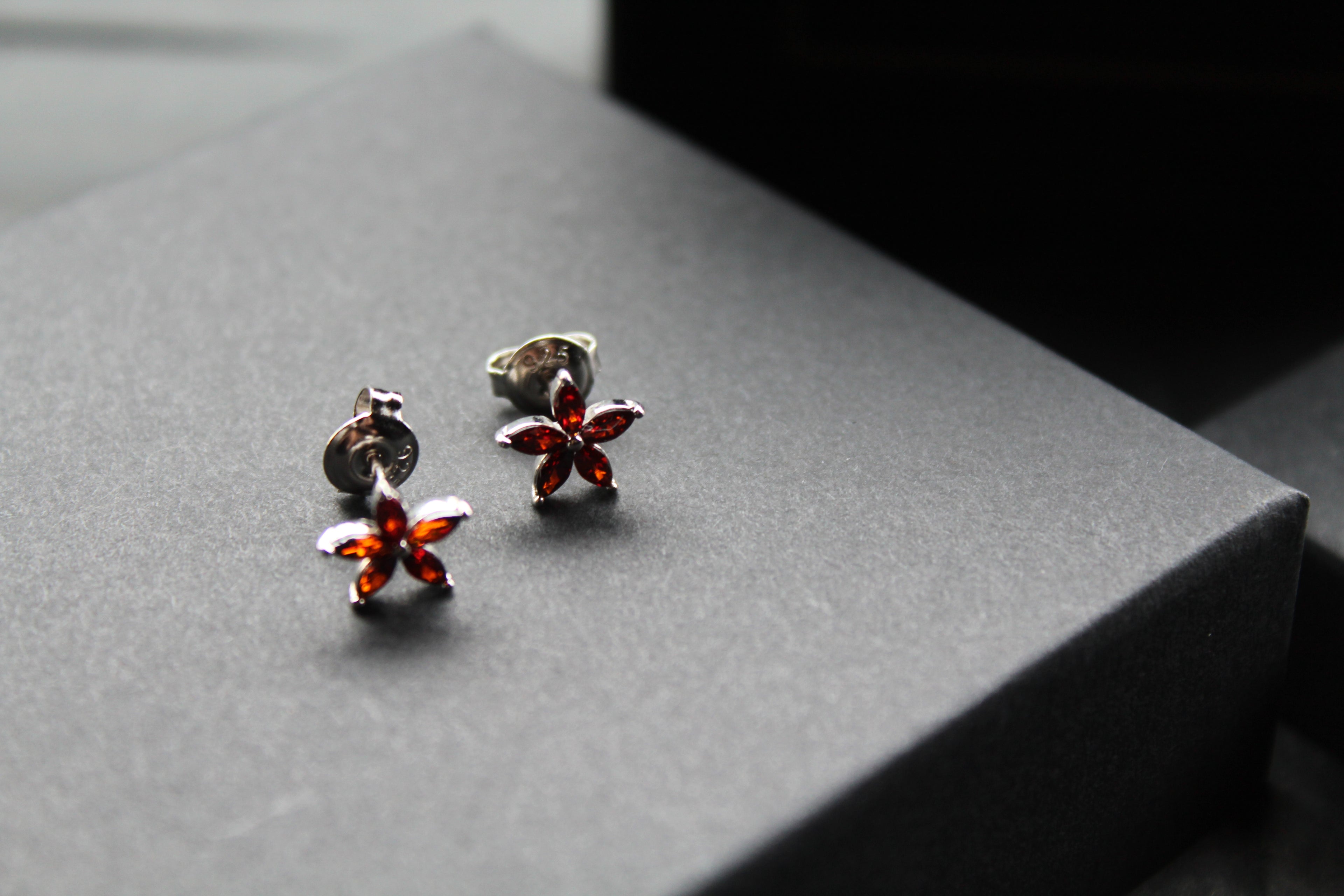 Ruby CZ Star Flower Earrings