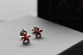 Ruby CZ Star Flower Earrings