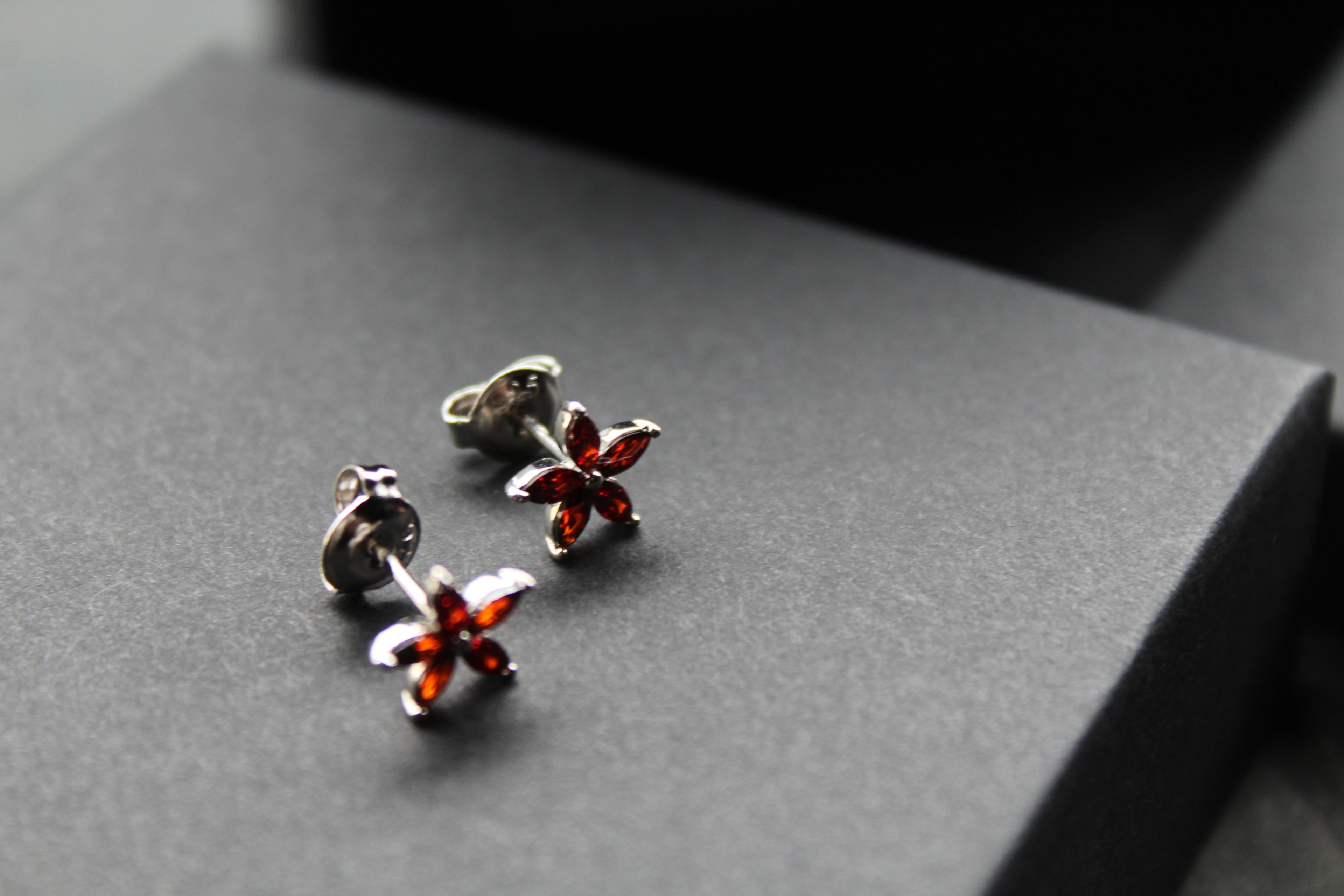 Ruby CZ Star Flower Earrings