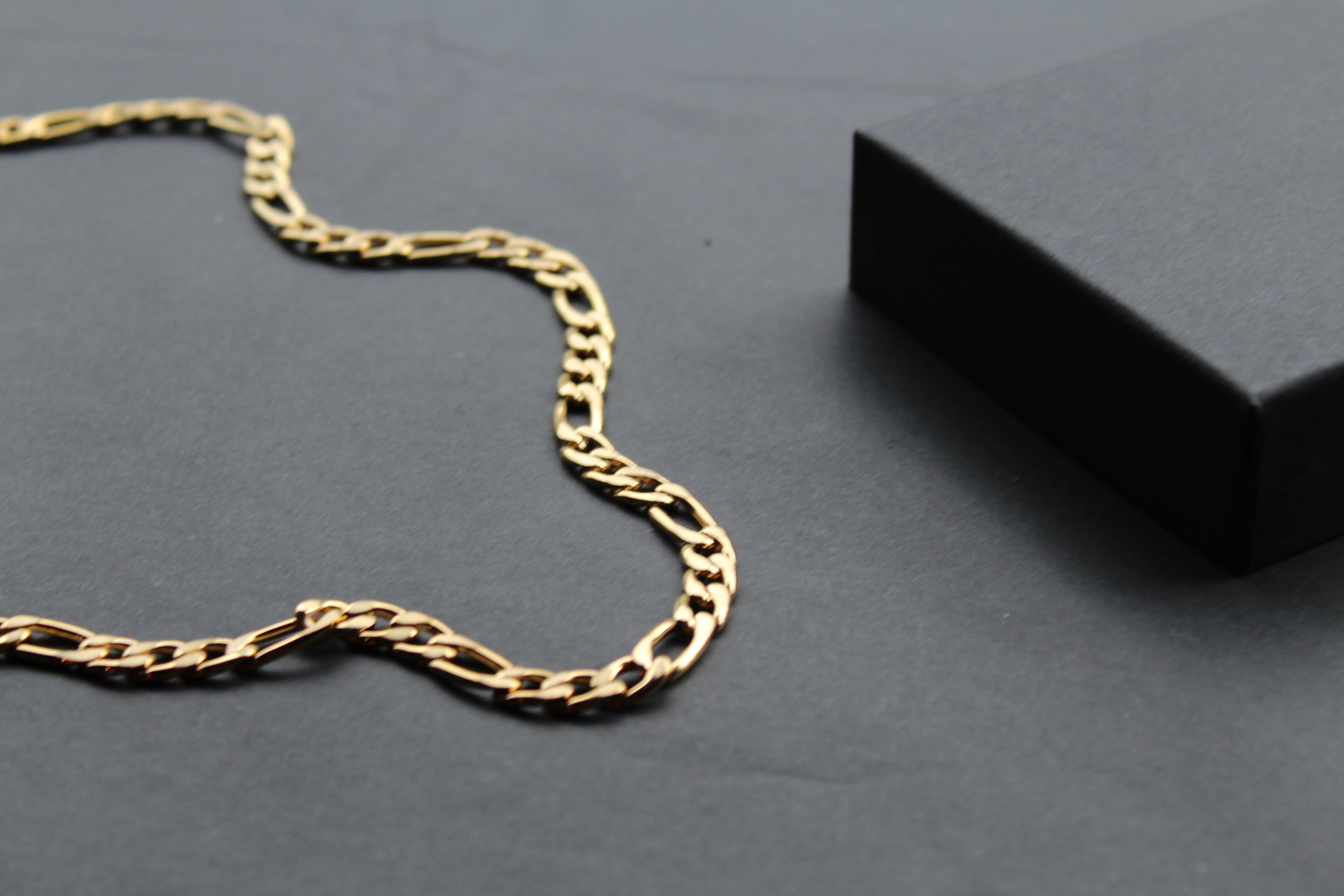 Steel Figaro Chain with Yellow Gold IP
