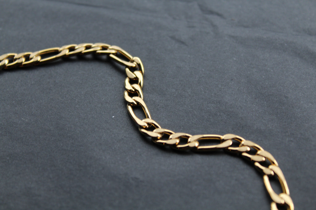 Steel Figaro Chain with Yellow Gold IP