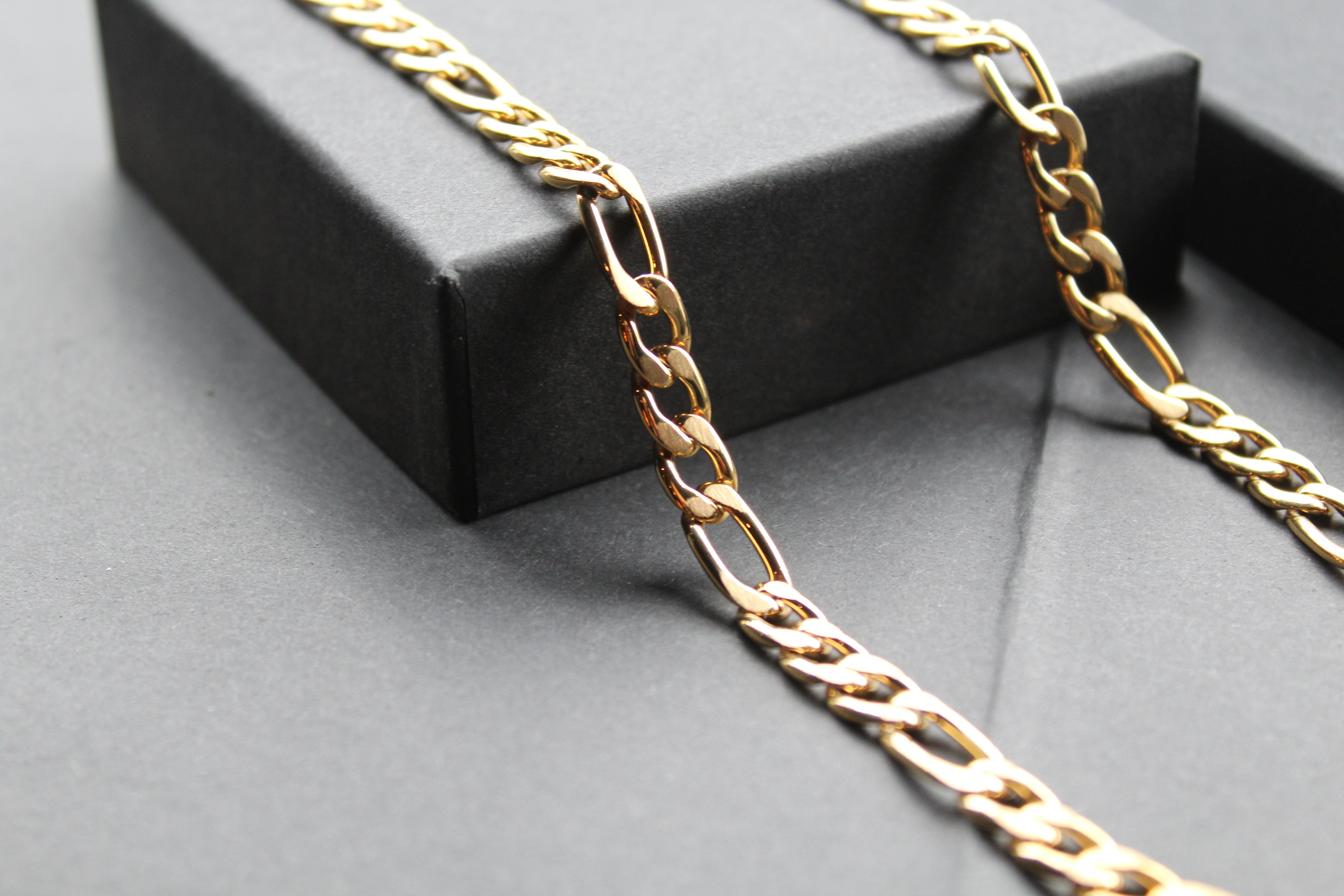 Steel Figaro Chain with Yellow Gold IP