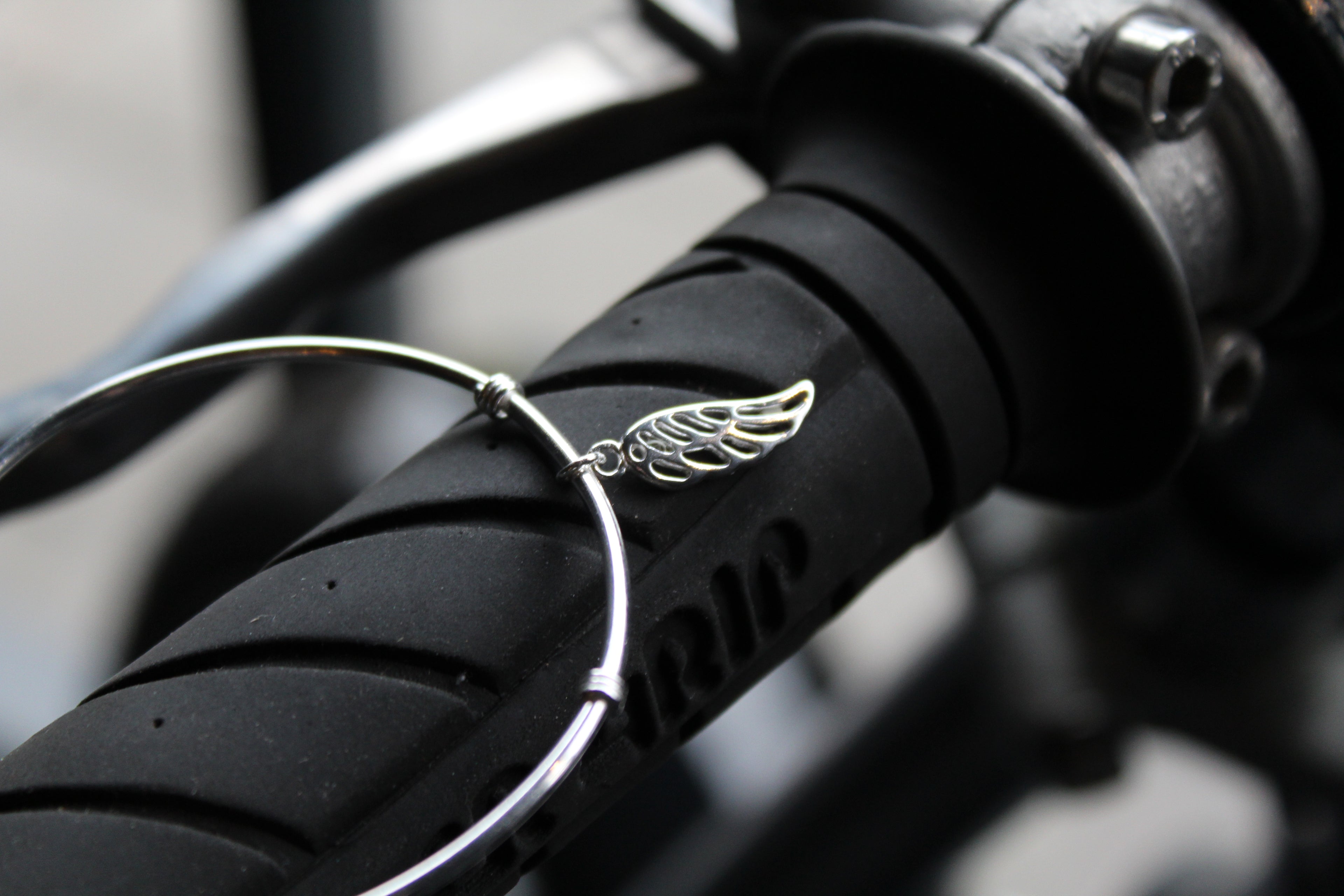 Silver Cuff with angel wing charm