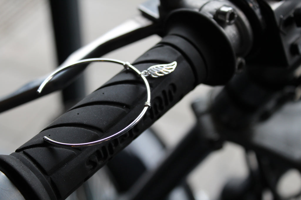 Silver Cuff with angel wing charm