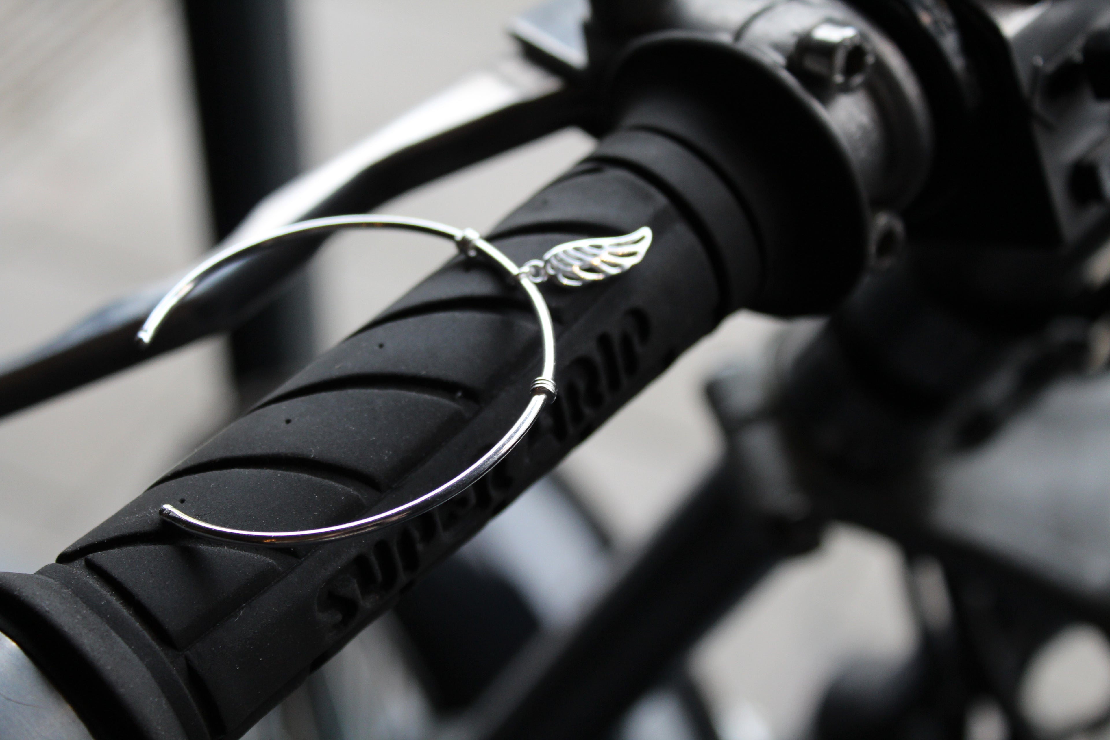 Silver Cuff with angel wing charm