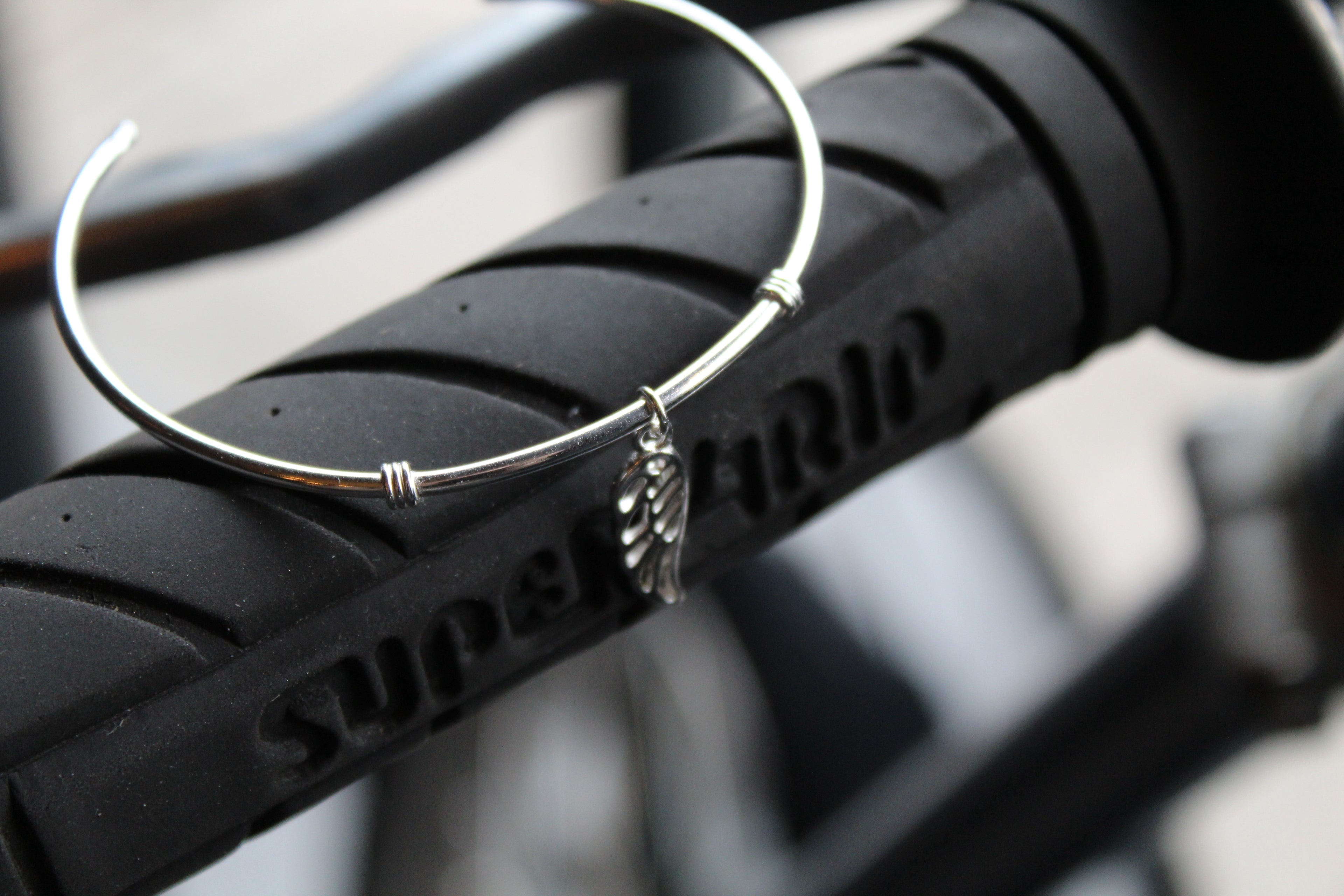 Silver Cuff with angel wing charm